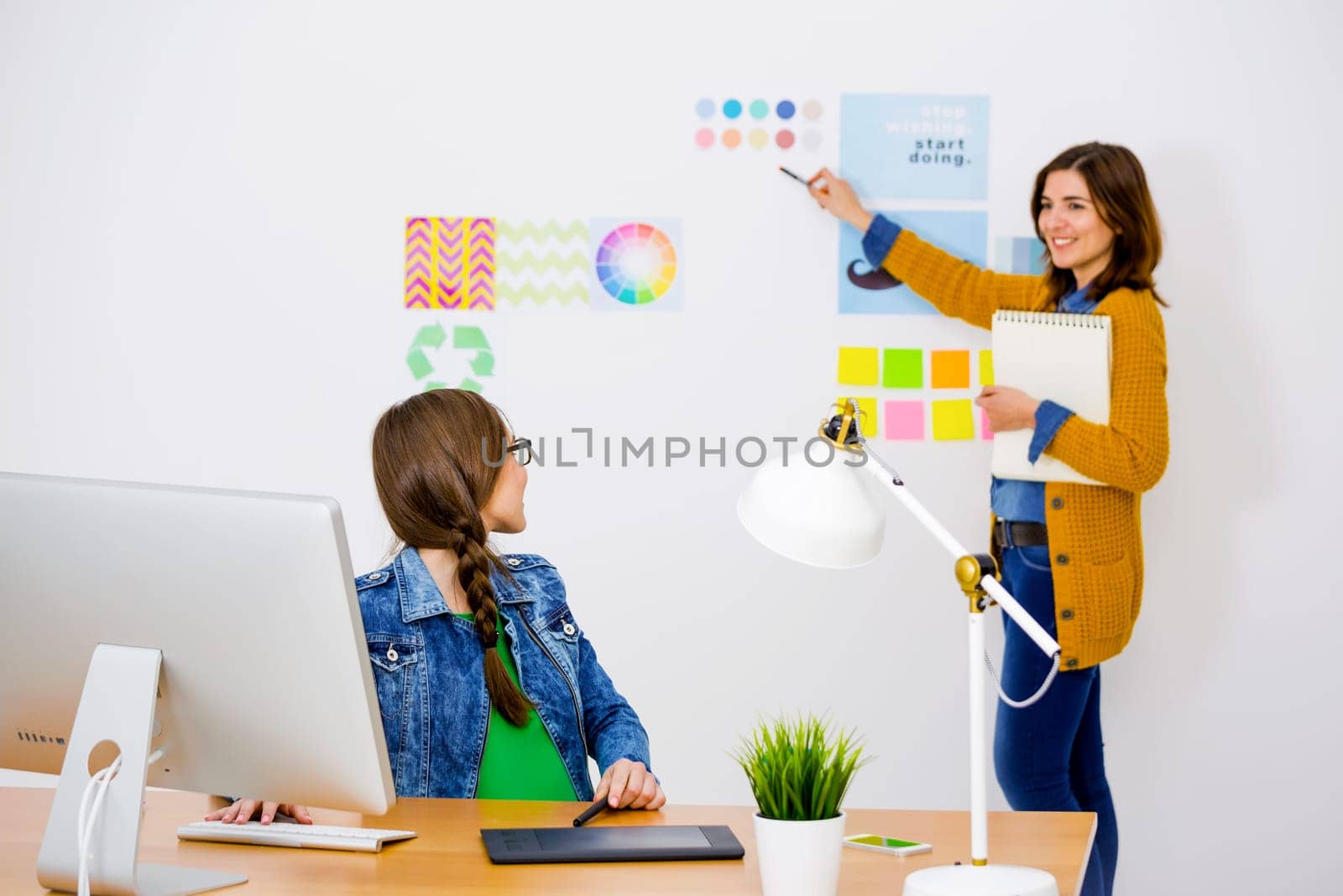 Women working at desk In a creative office, team work