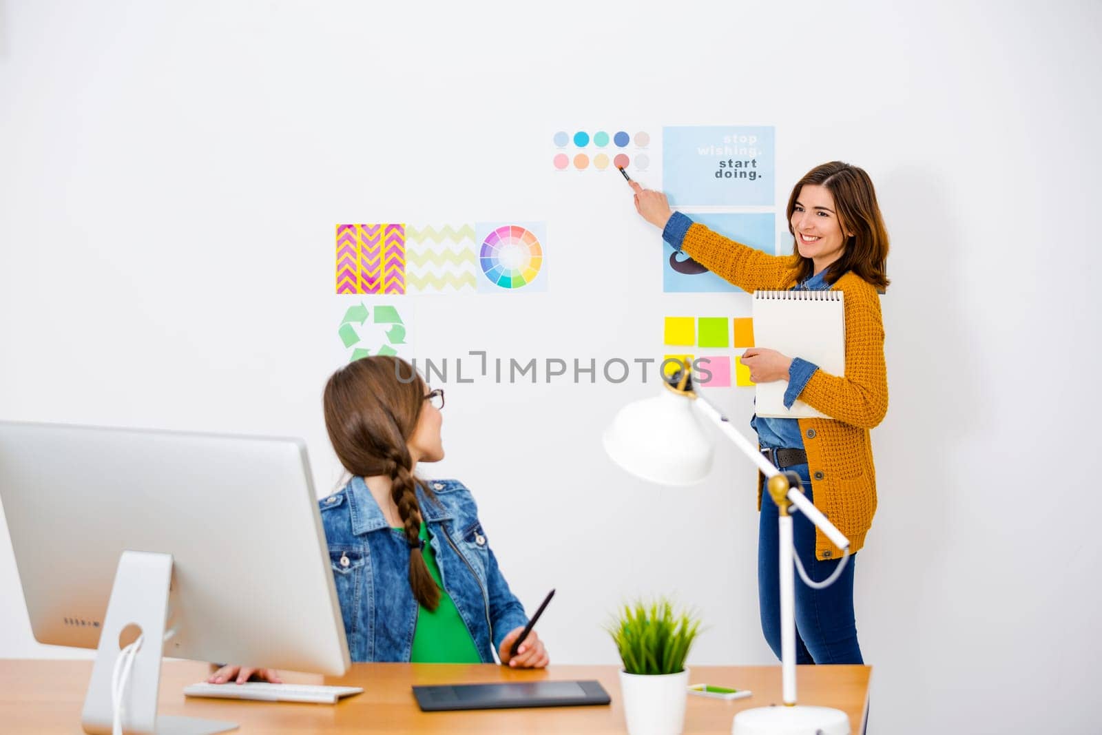Women working at desk In a creative office, team work