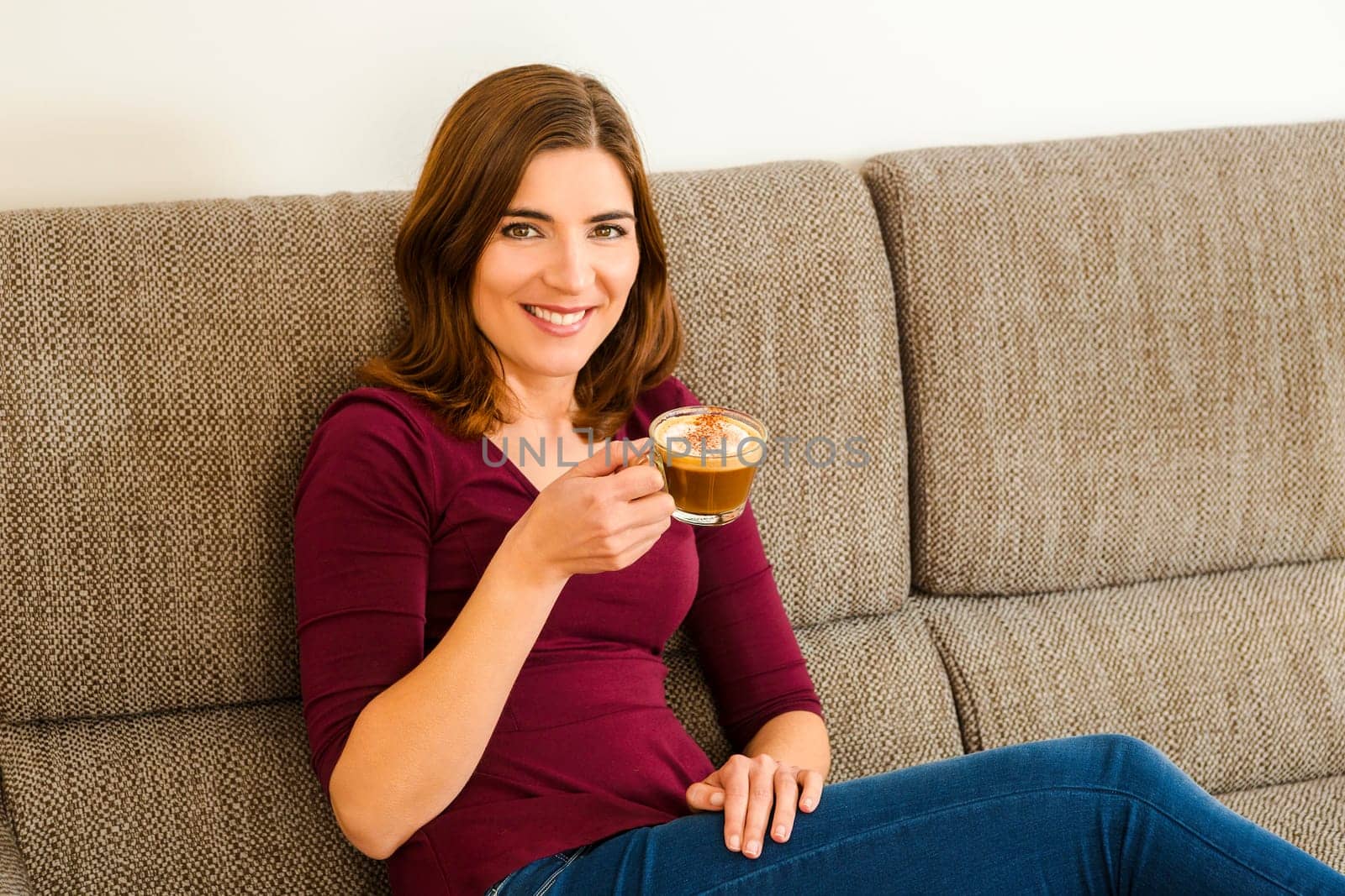 Beautiful woman at home Having a good time with cup a coffee
