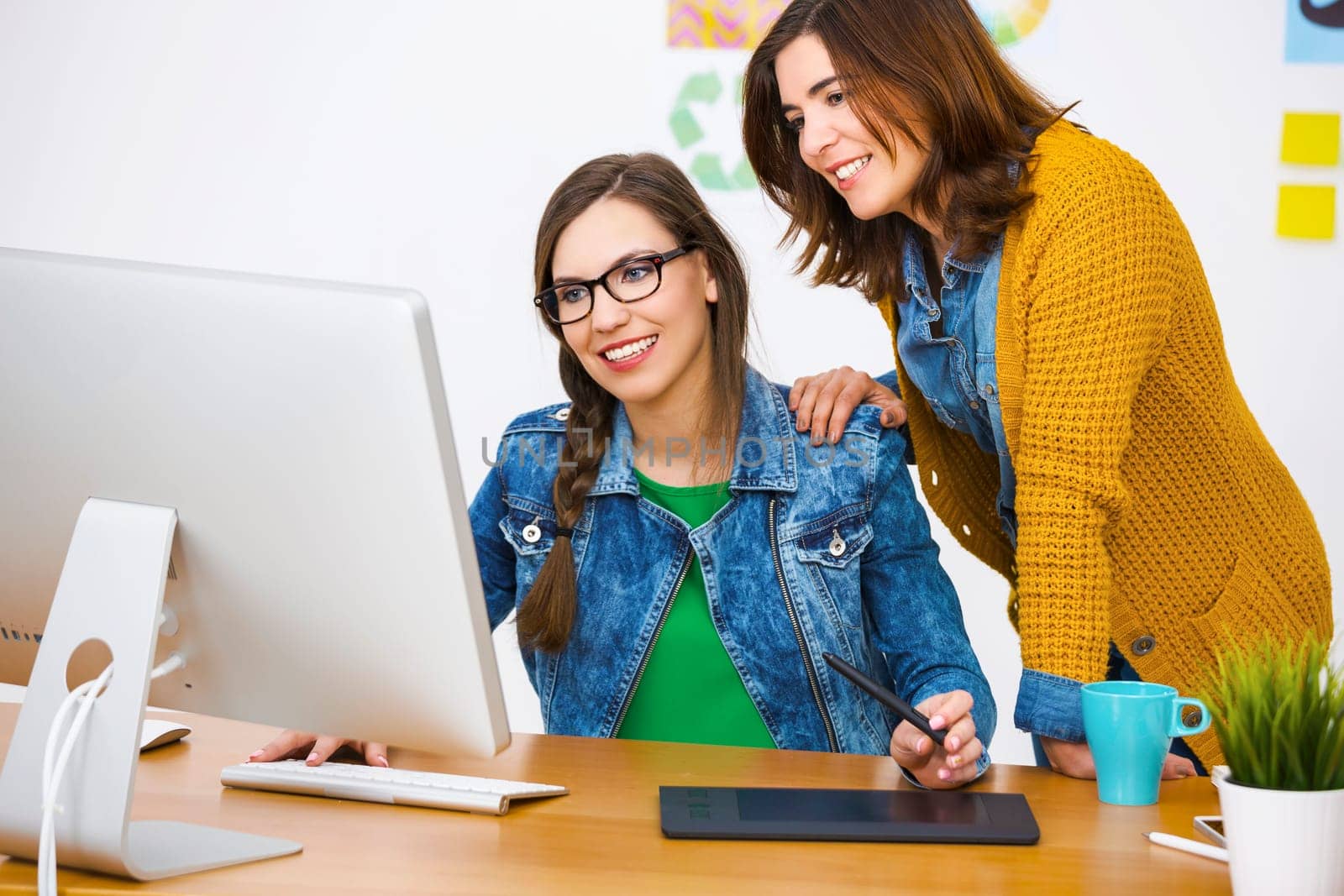 Women working at desk In a creative office, team work