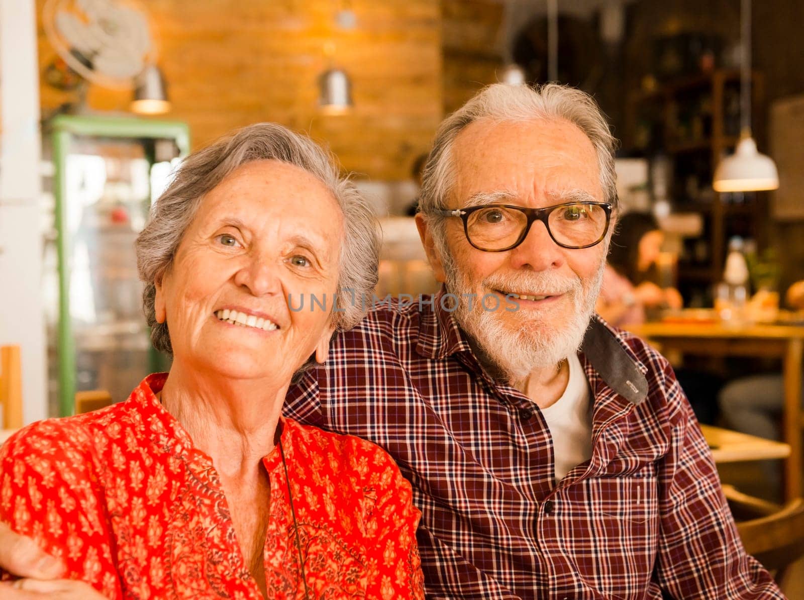 Old couple at the restaurant and  having a good time