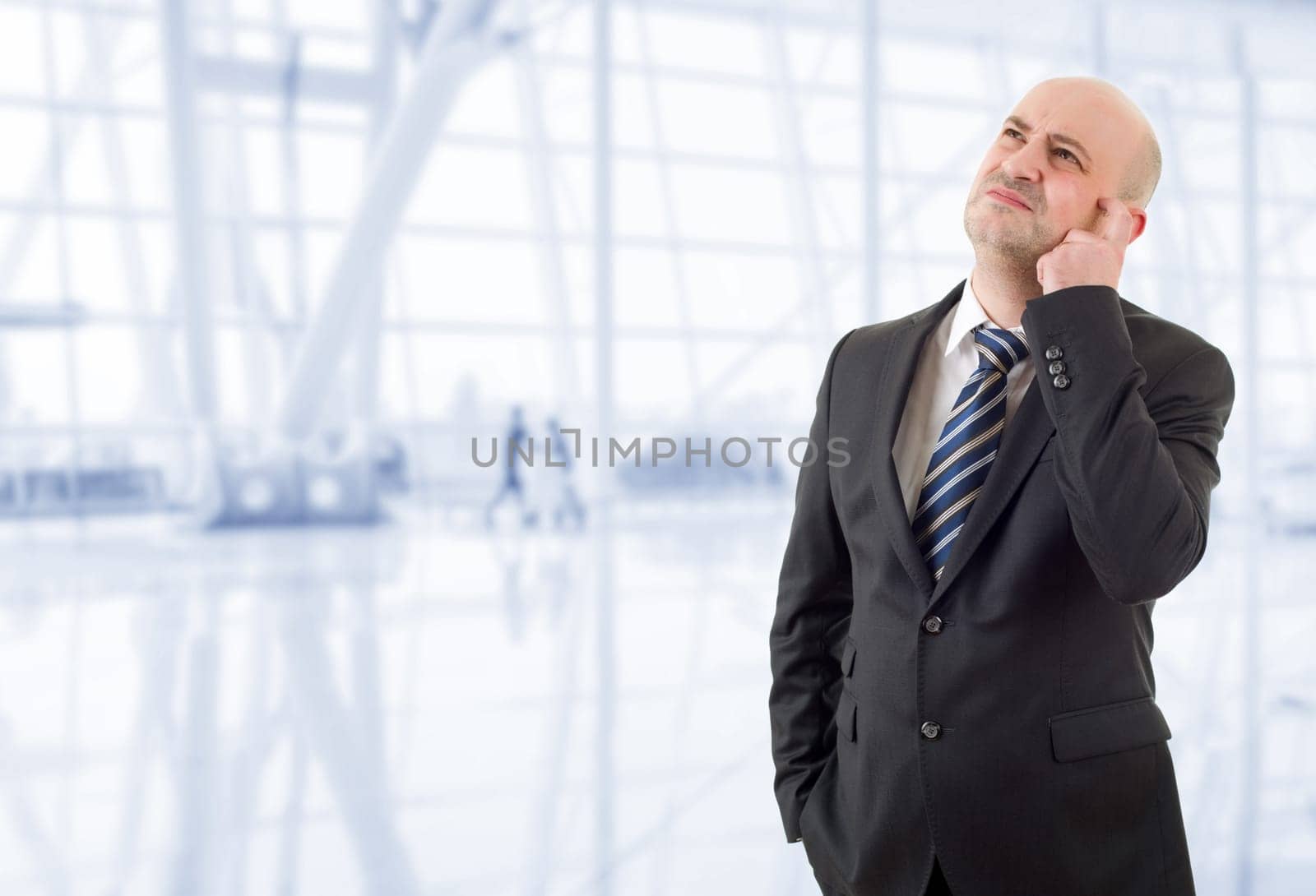 young business man thinking, at the office