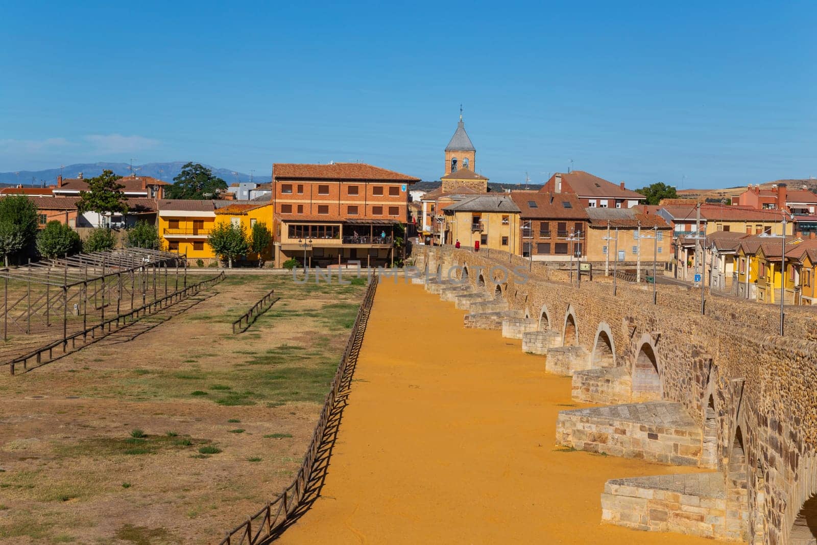 Hospital de Orbigo, Spain - August 18, 2022 - Some pilgrims walking along the way of St.James, in Hospital de Orbigo