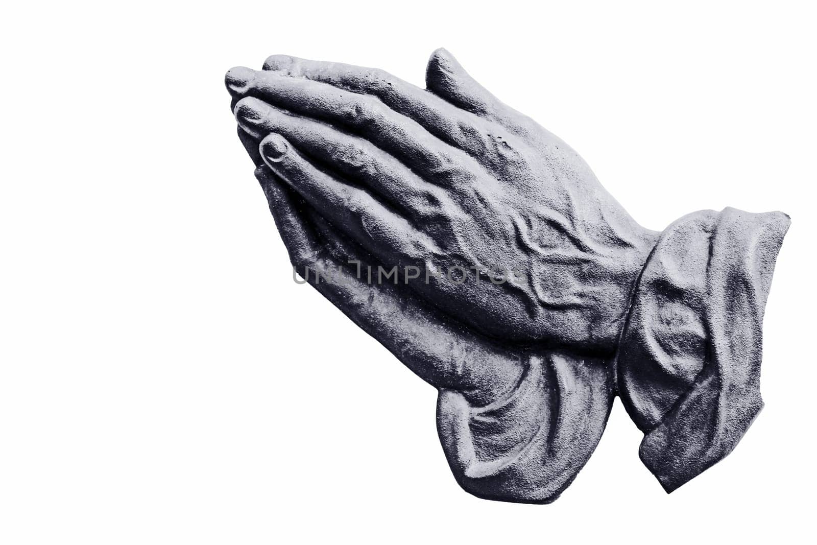 Metal praying hands on a white background