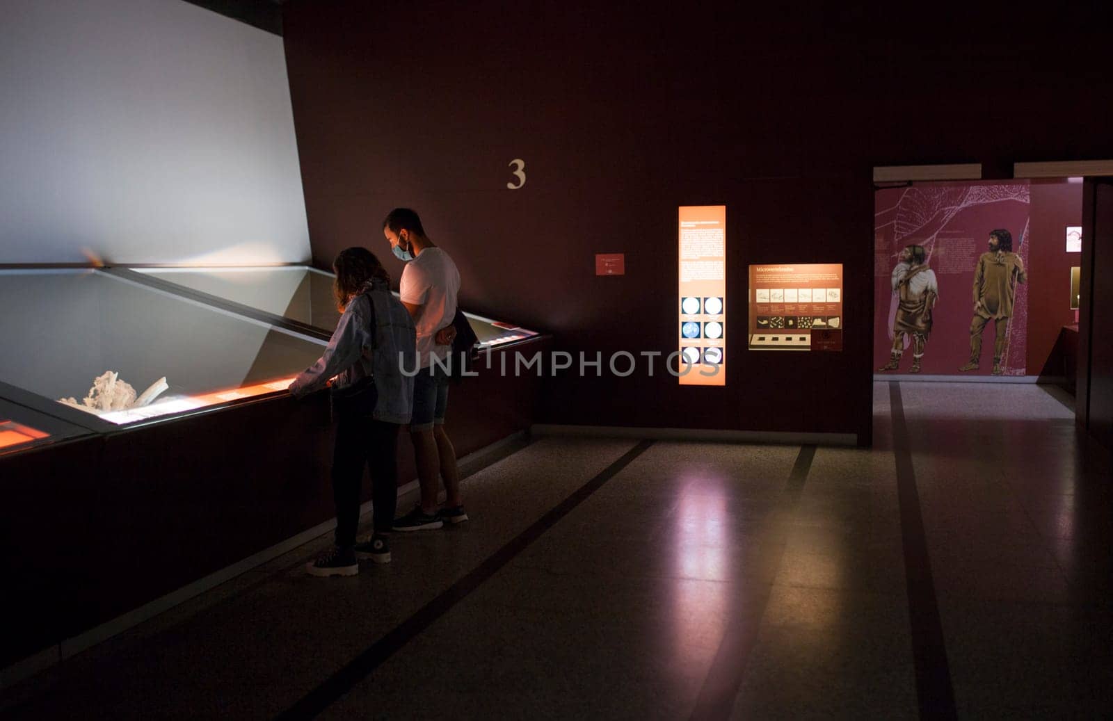Alcala de Henares, Spain - Oct 10th, 2020: Visitors observing the exhibition at National Archeological Museum of Madrid. Regional Archaeological Museum of Madrid