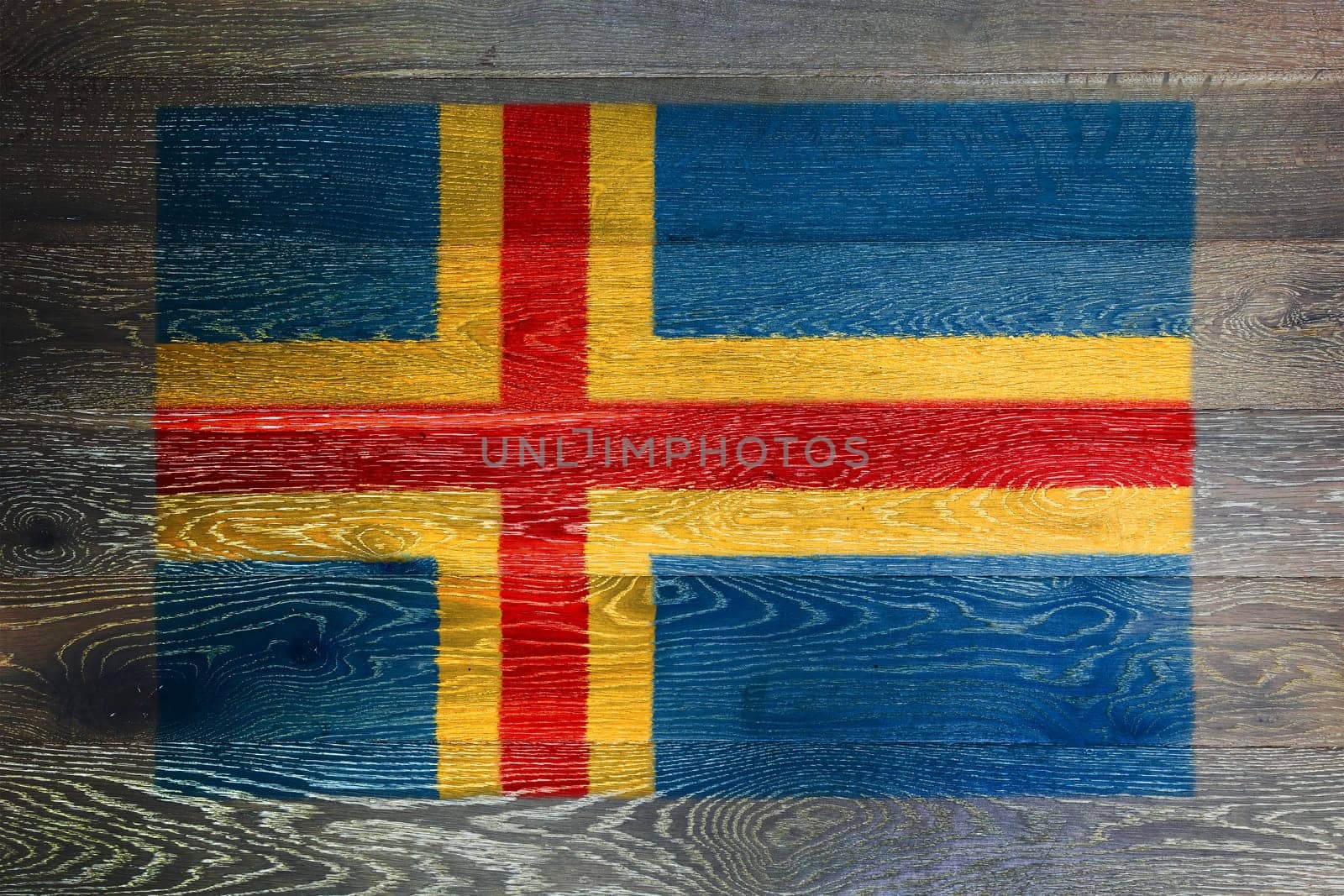 An Aland islands flag on rustic old wood surface background