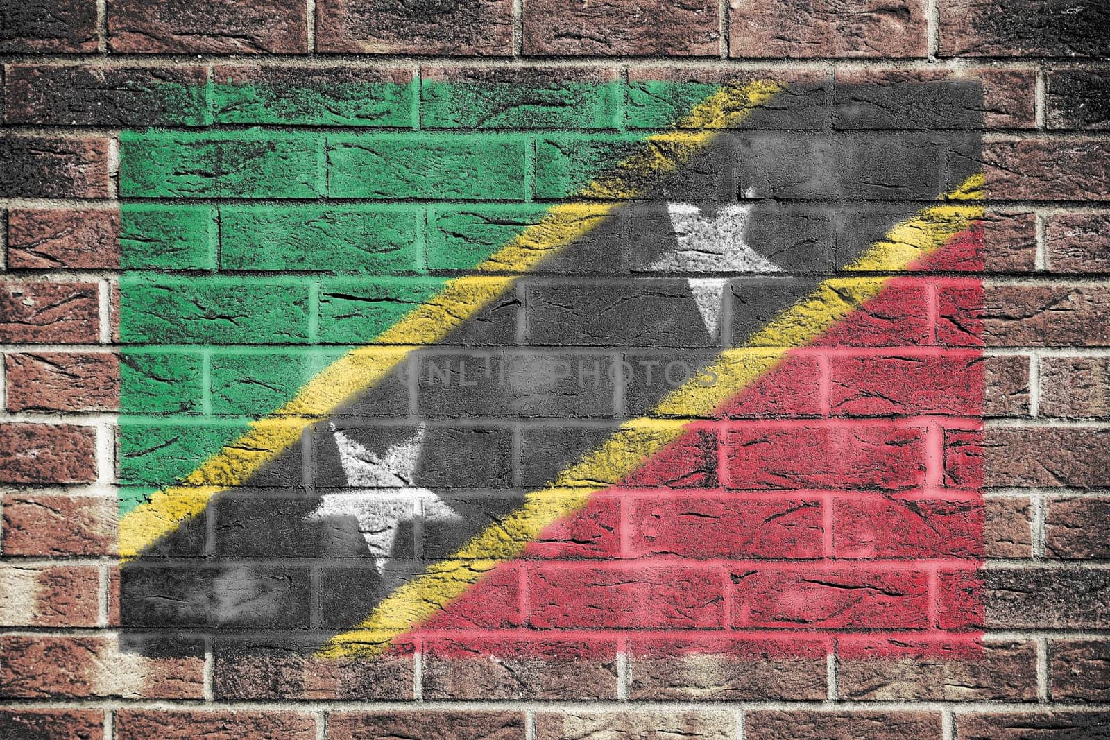 A St Kitts-Nevis flag on old brick wall background