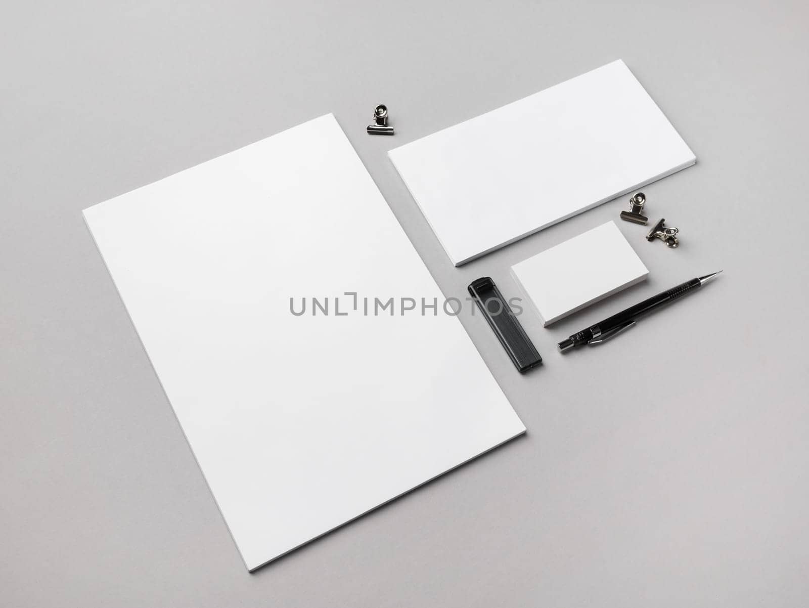 Blank branding stationery set on gray paper background. Responsive design template.