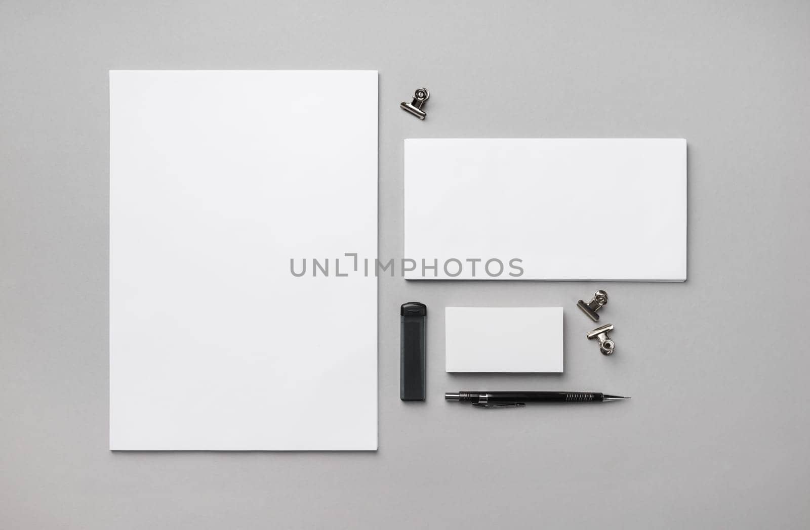 Blank stationery set on gray paper background. Template for branding design. Flat lay.
