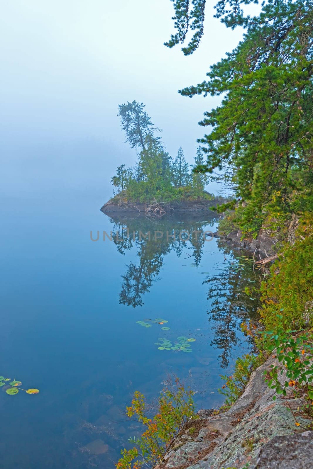Quiet Waters With a Quiet Island in the Morning Fog on Jenny Lake in the Boundary Water Canoe Area in Minnesota