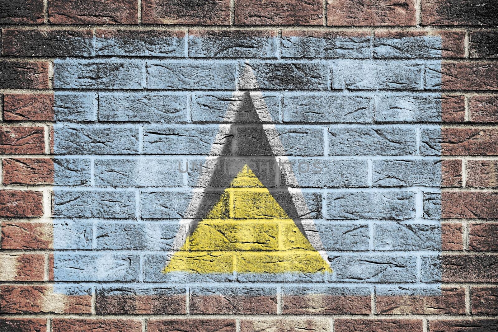 A St Lucia flag on old brick wall background