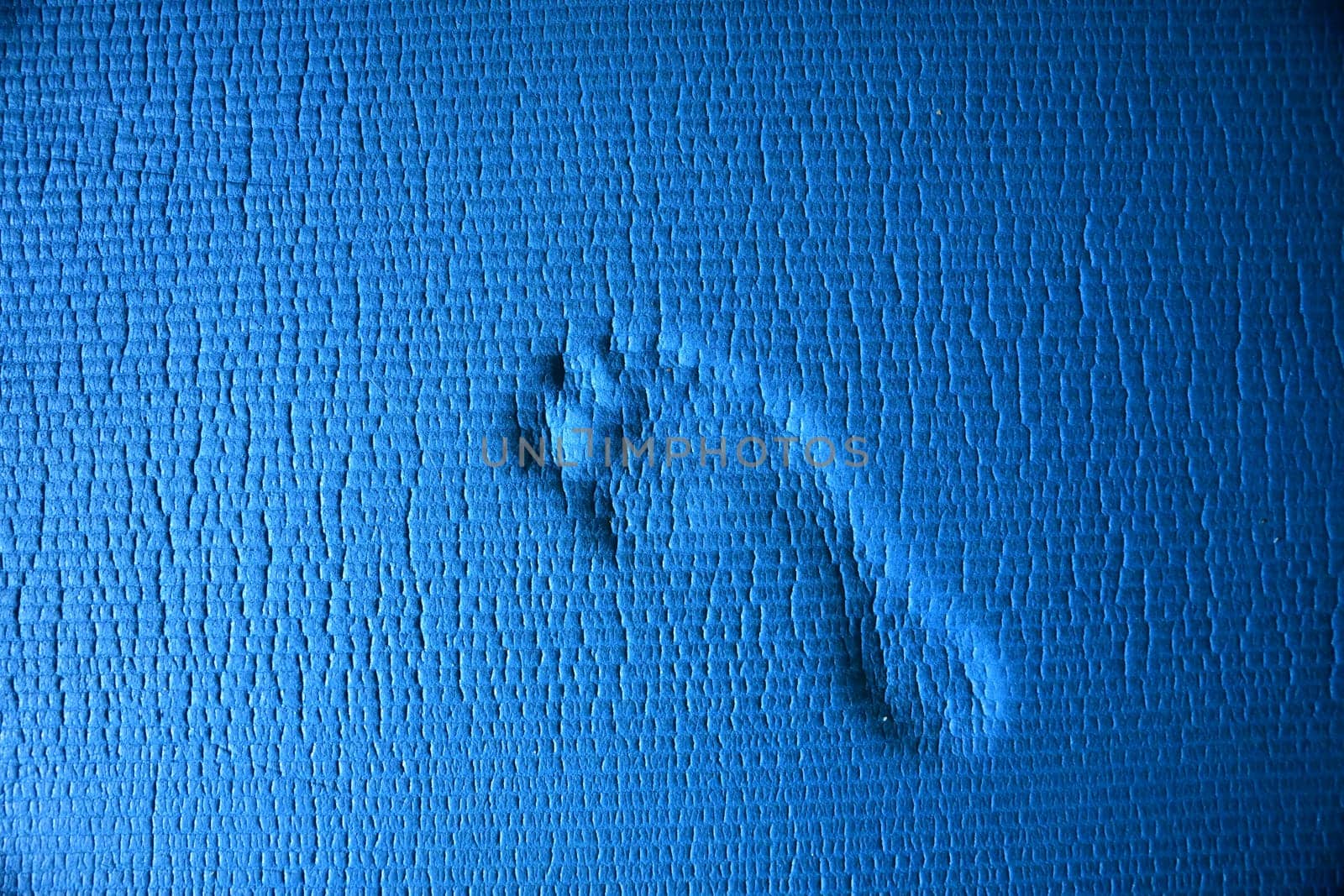 Footprint of a human on a blue underground