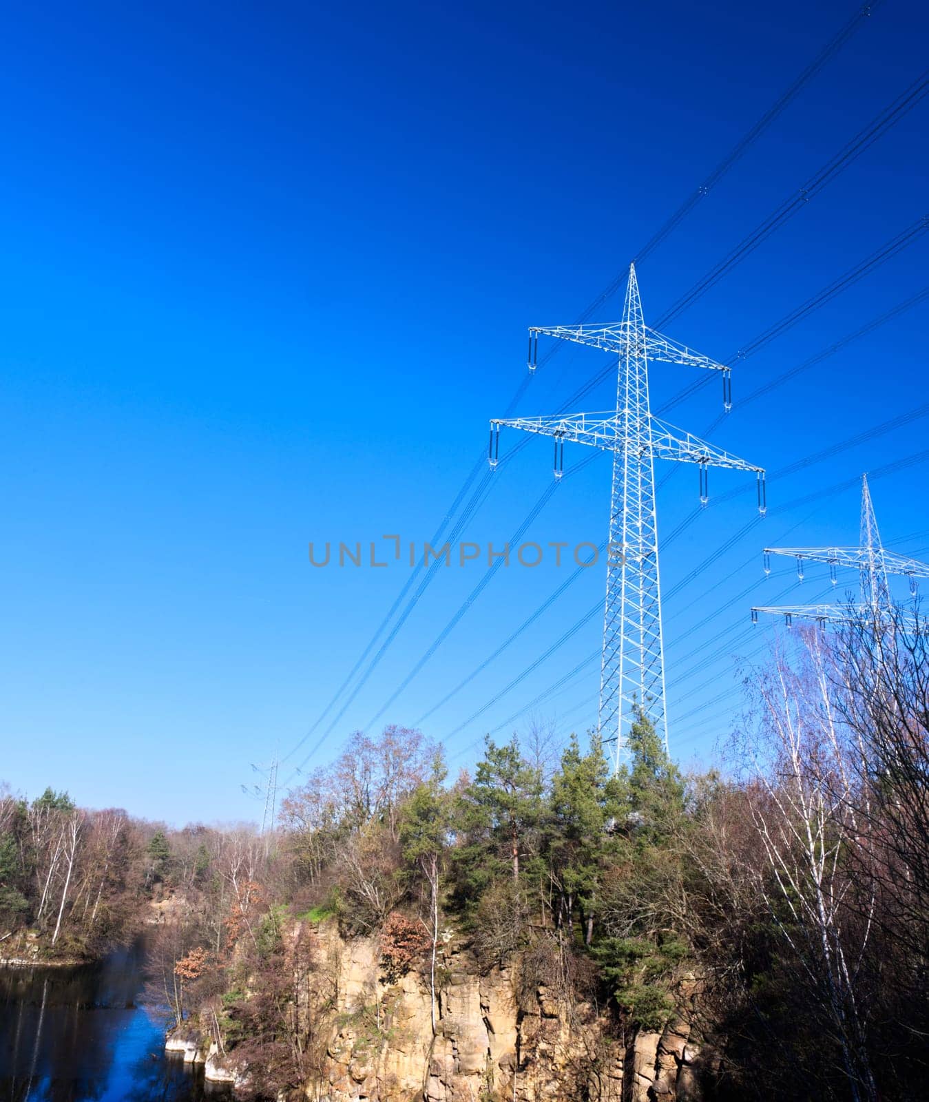 power poles at a lake in a Stone pit, local recreation area