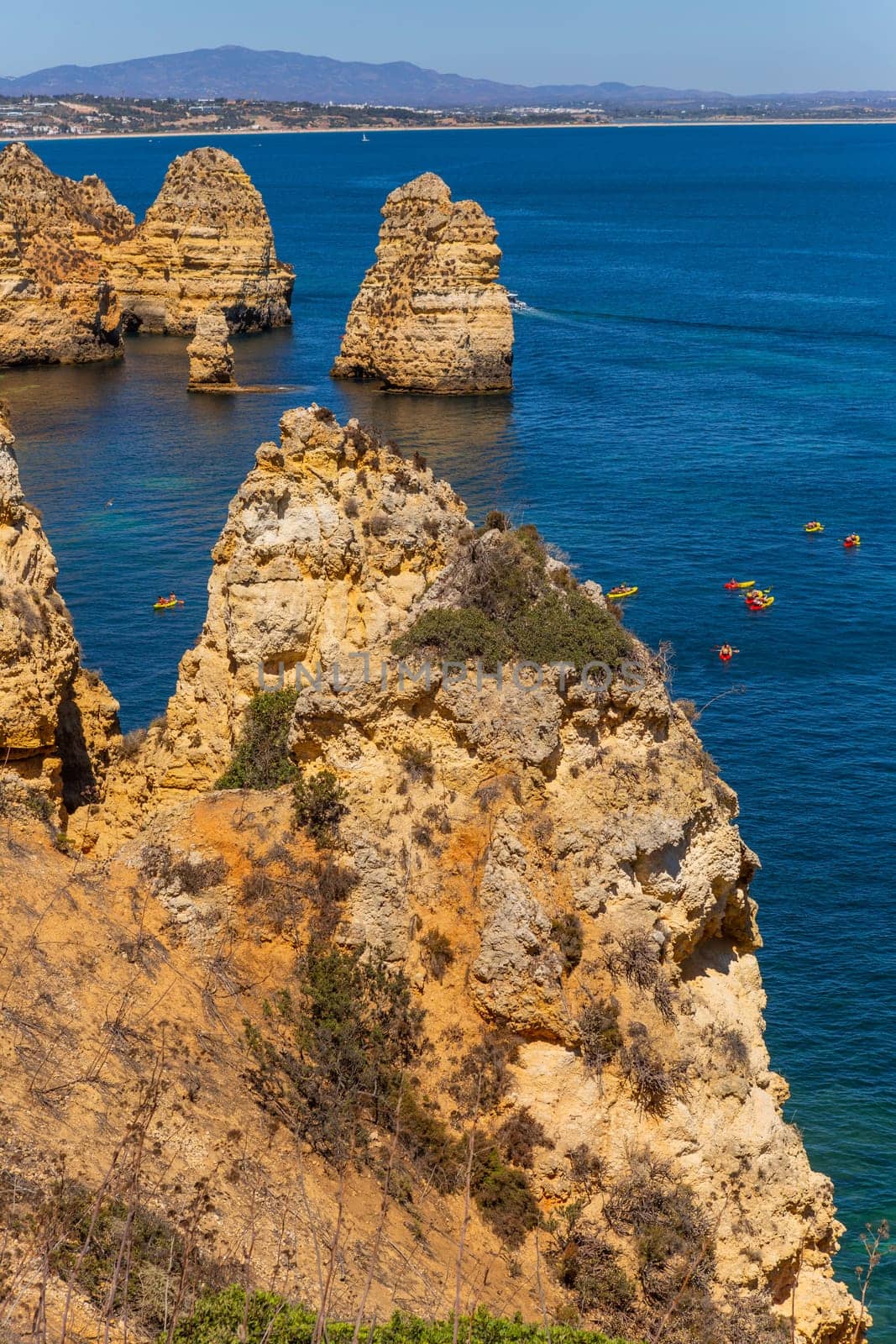 Lagos, Portugal - 25 August 2025: Tourists visiting Ponta da Piedade, in Lagos. Algarve, Portugal