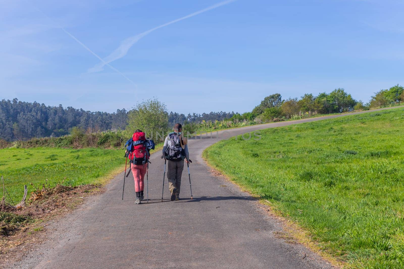 Navarre, Spain, 26 March, 2023: Pilgrims walk along the Camino De Santiago, the Way of St. James pilgrimage route, Navarra, Spain.