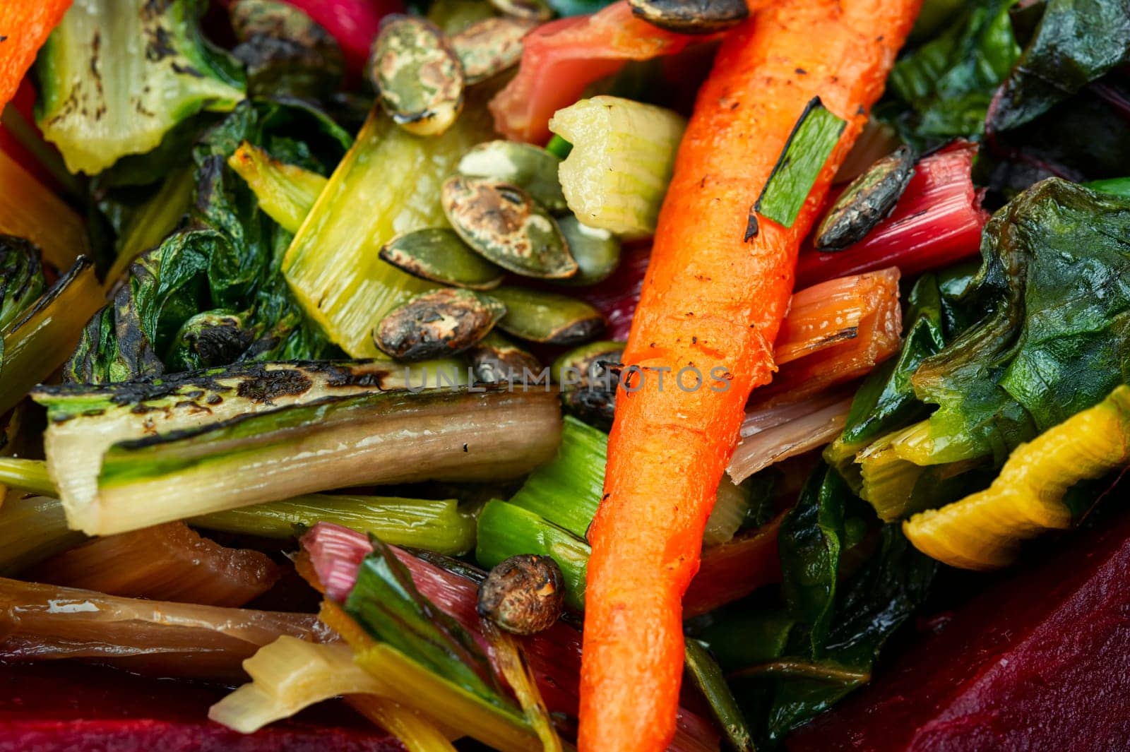 Healthy diet food- stewed chard leaves, beets and carrots. Organic food. Flat lay