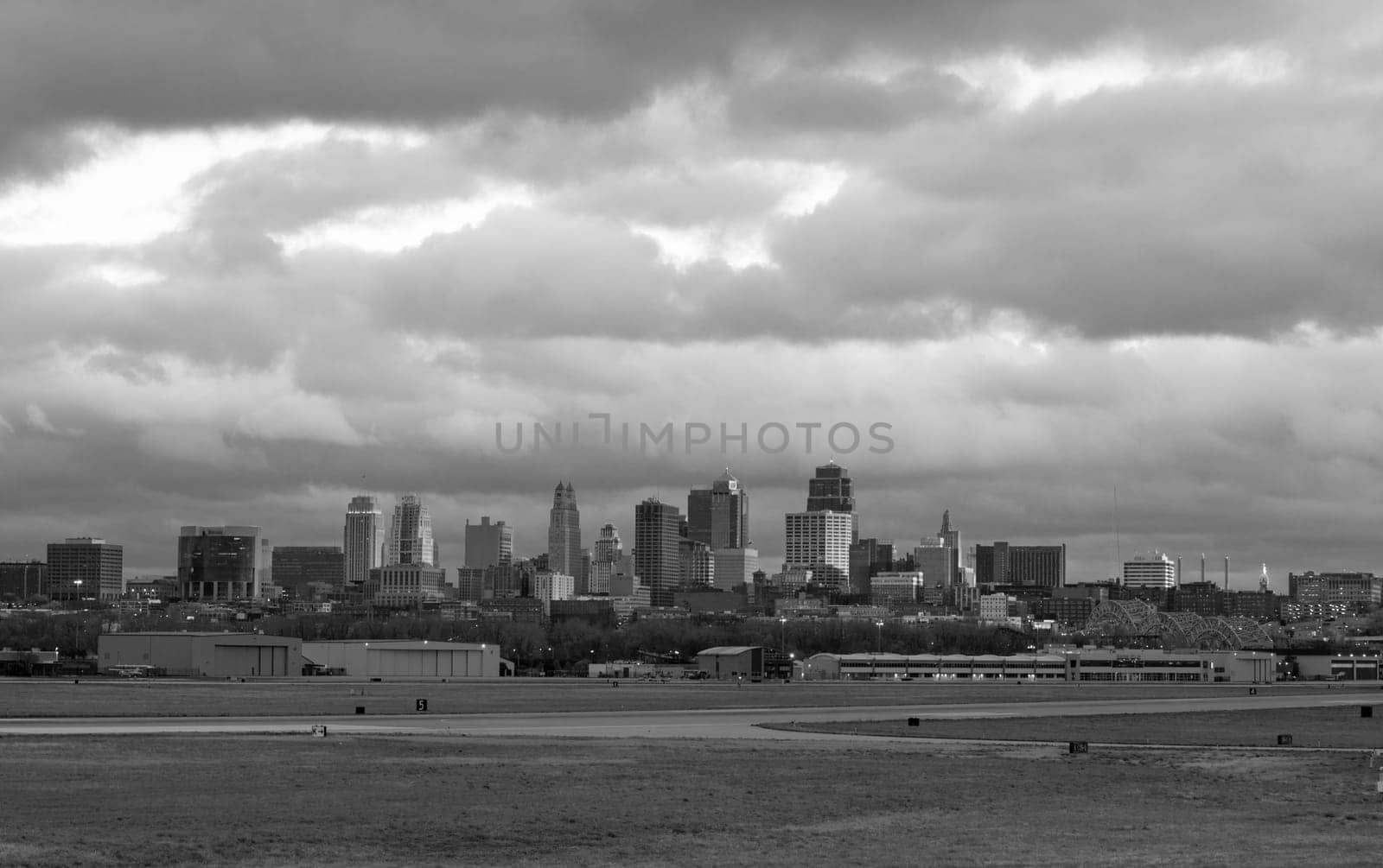 Beautiful light breaks through the clouds just before sunset to light Kansas City Missouri