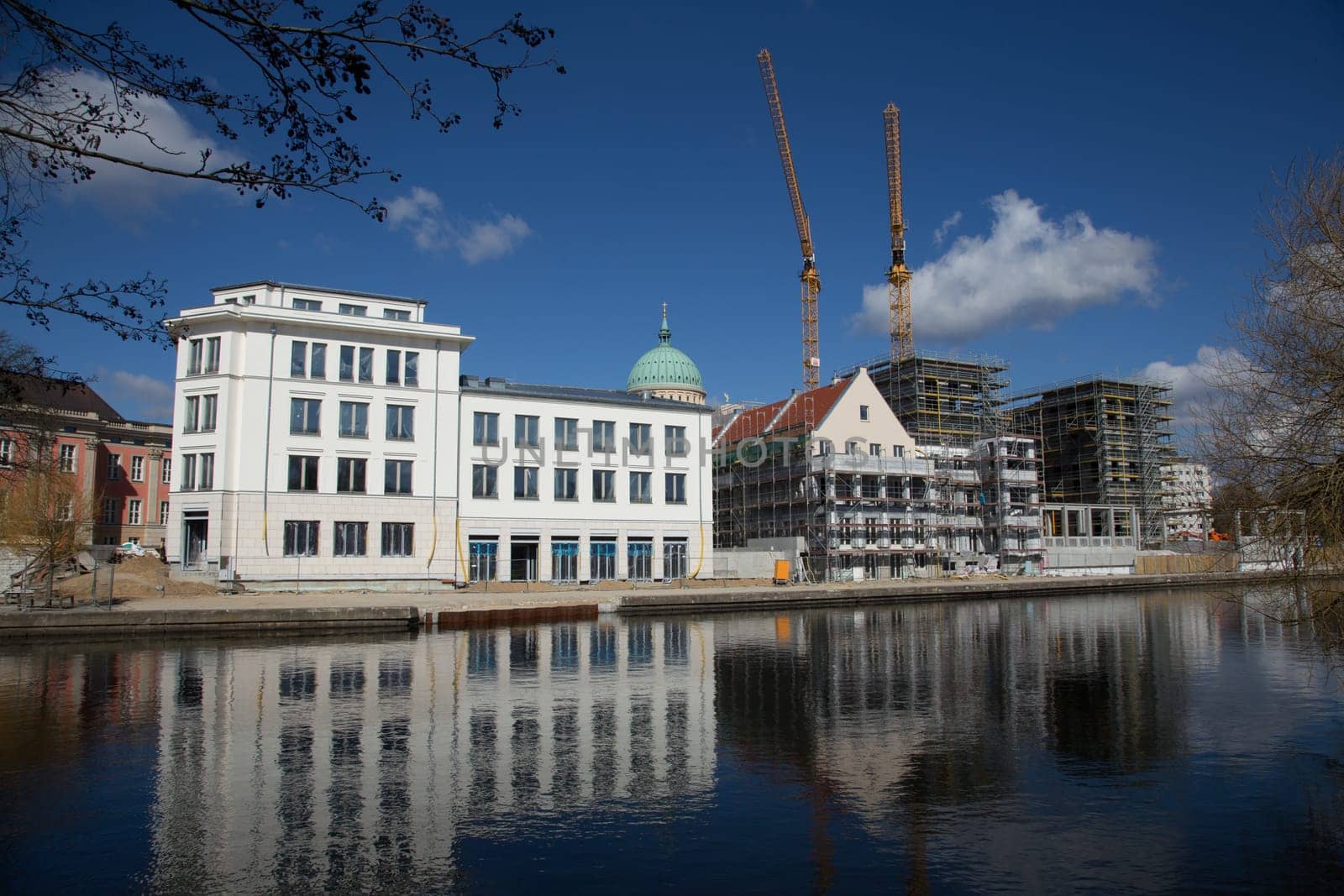 White new building in old style on the old ride in Potsdam