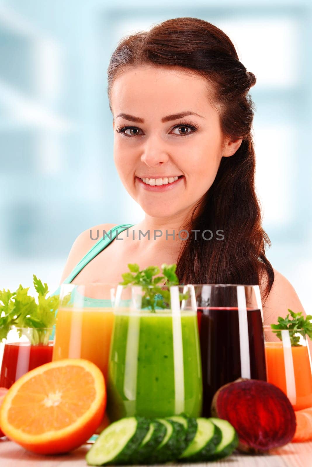 Young woman with variety of vegetable and fruit juices. Detox diet.
