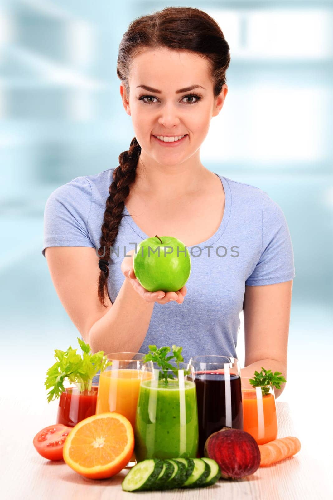 Young woman with variety of vegetable and fruit juices. Detox diet.