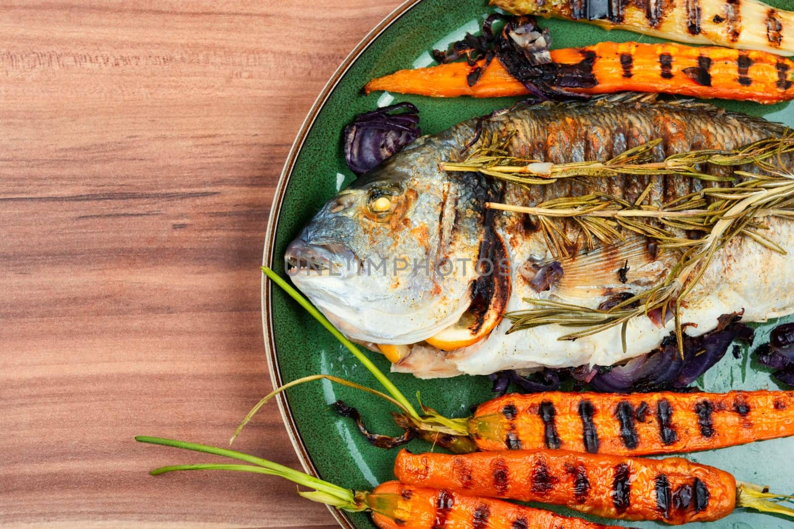 Delicious fish dorada bbq with roasted vegetables. Bbq sea bream.