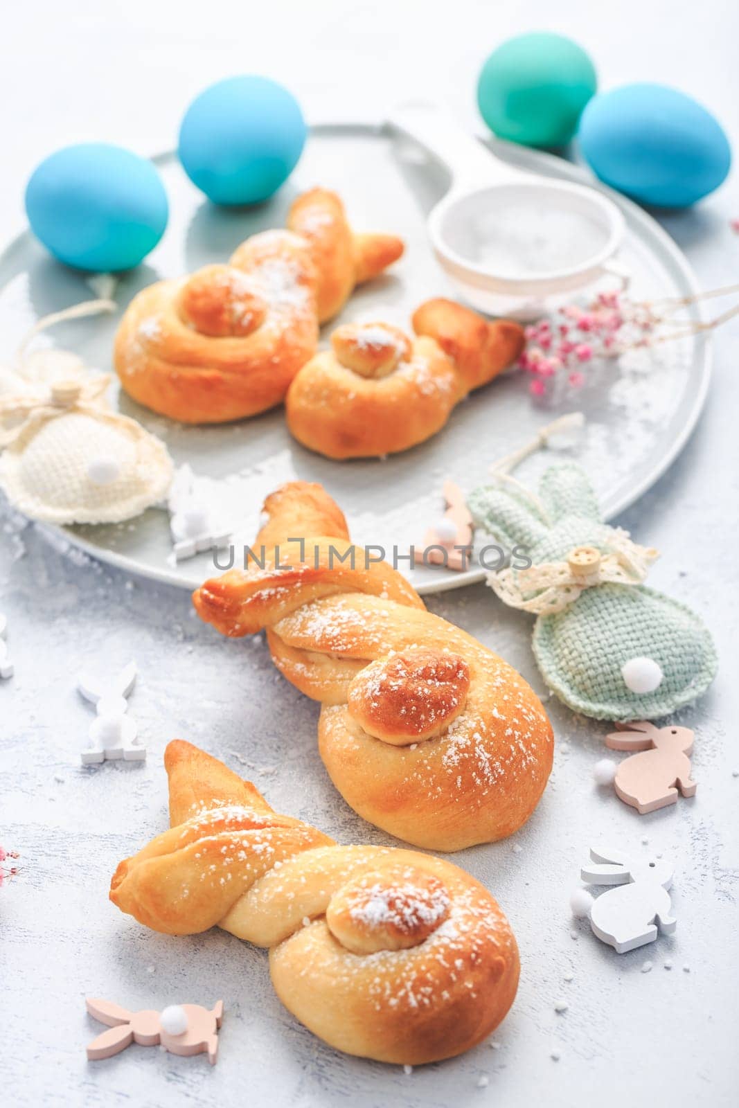 Easter baking - Buns made from yeast dough in a shape of Easter bunny and colored eggs