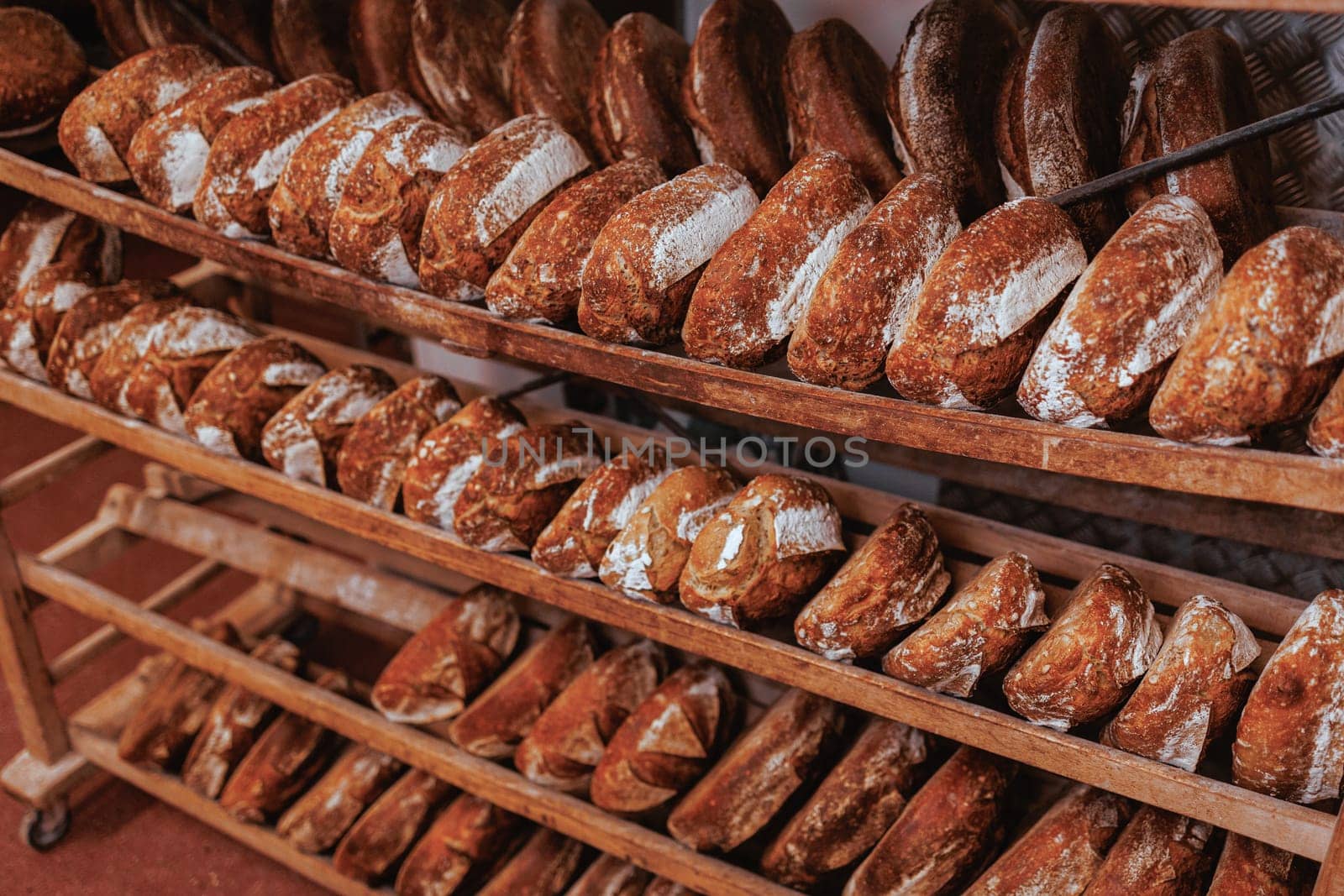 Organic Bakery - details of baker baking bread handmade