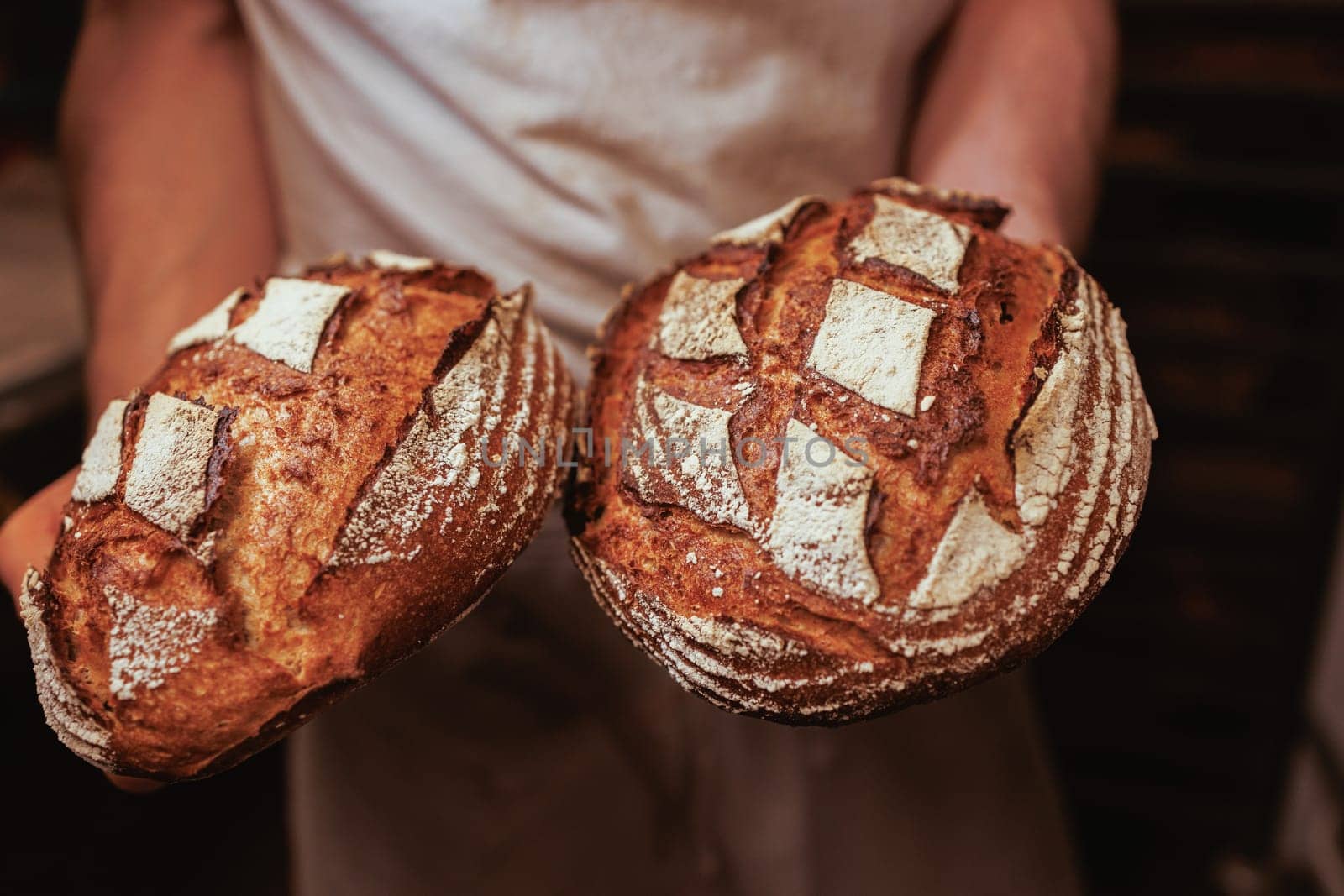 Organic Bakery - details of baker baking bread handmade