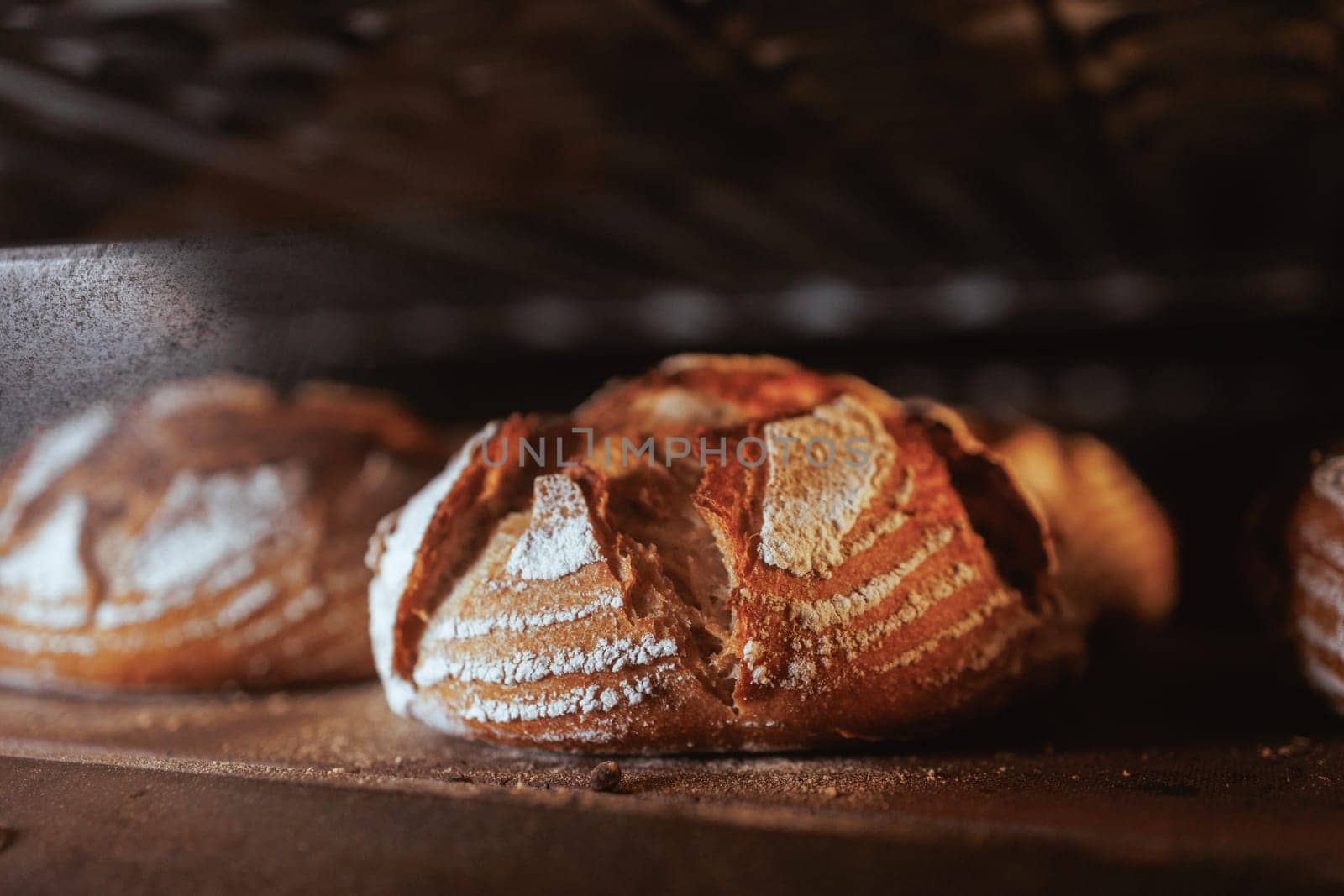 Organic Bakery - details of baker baking bread handmade