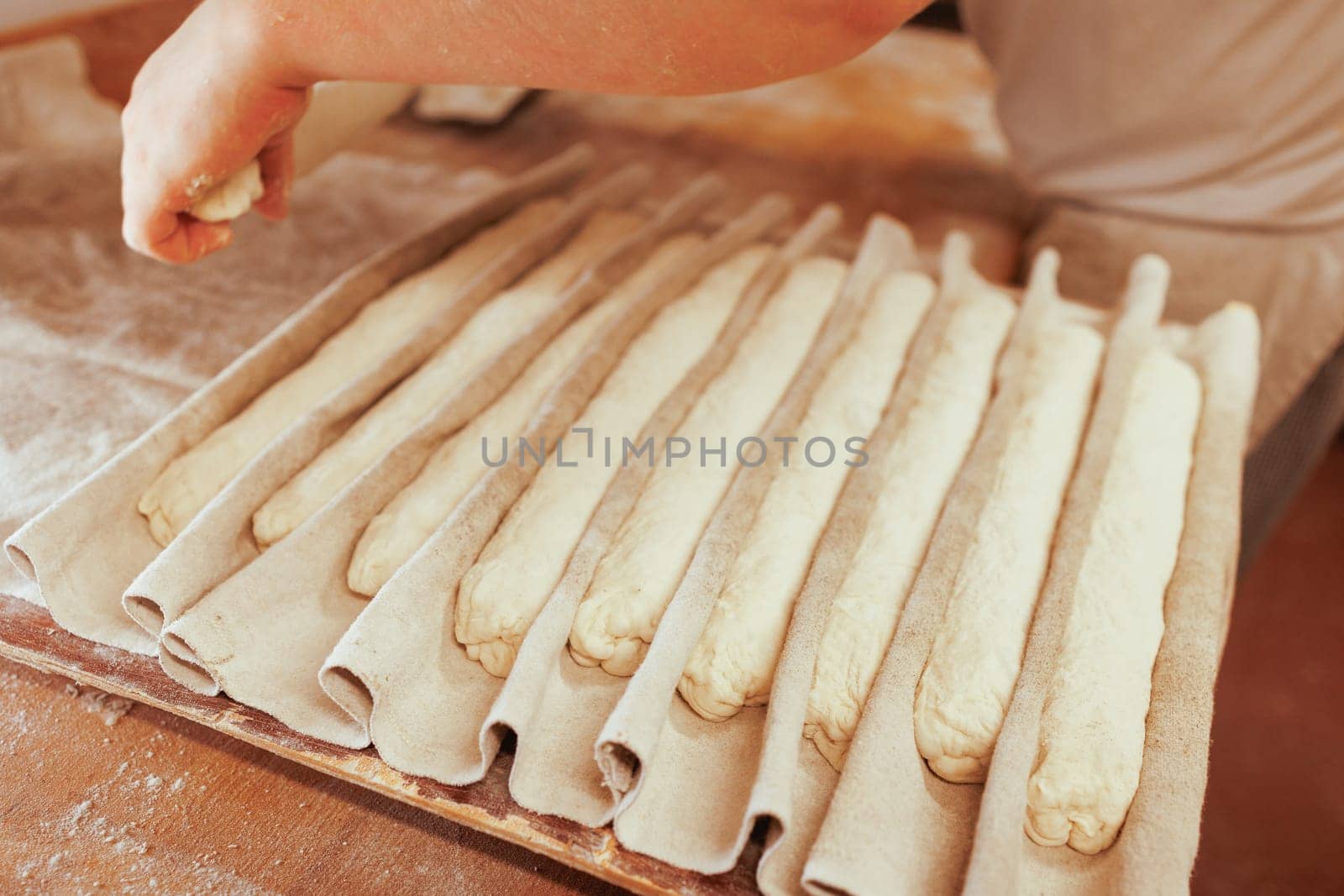 Organic Bakery - details of baker baking bread handmade