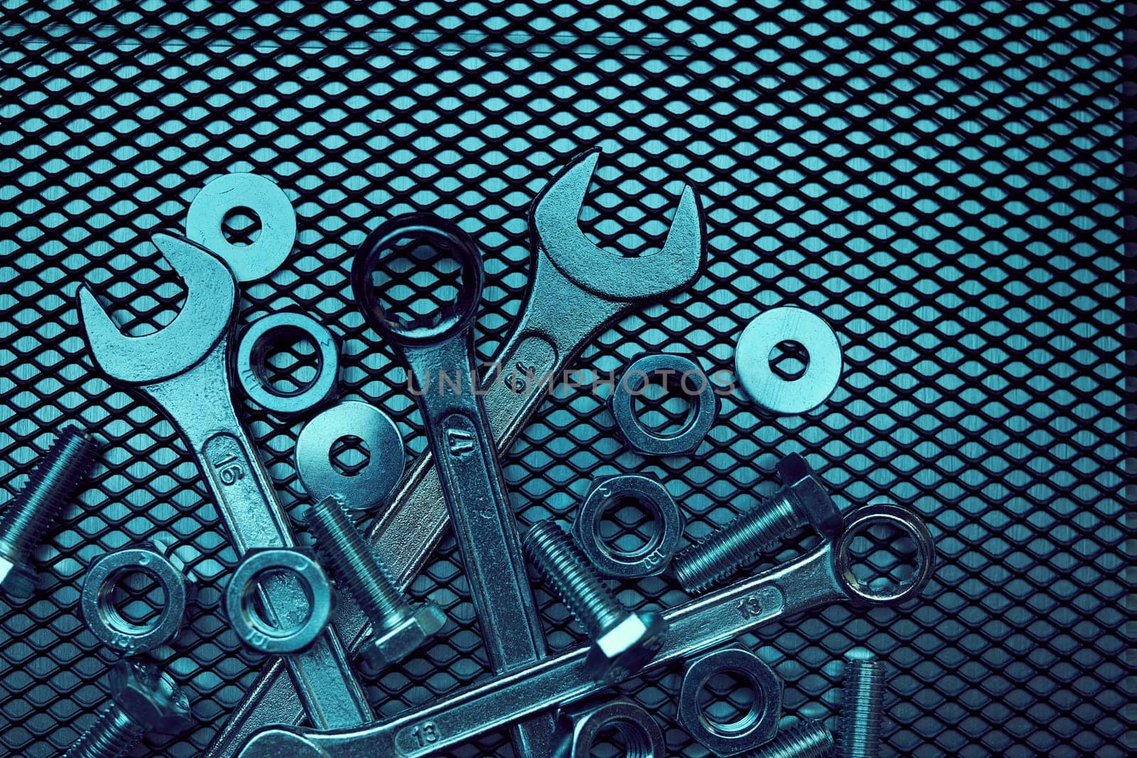 Set of chrome wrenches on steel surface. Mechanic tools for maintenance. Hardware tools to fix. Technical tools background
