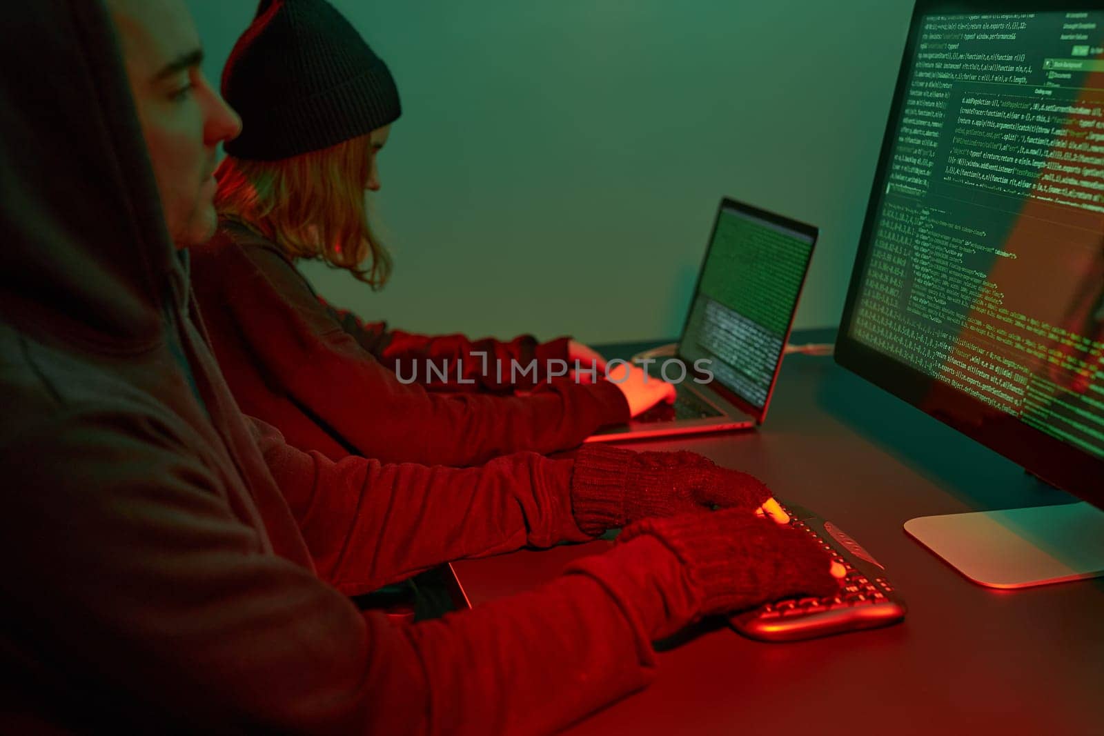 Anonymous people using computer and programming to break code. Cyber security threat. Internet and network security. Access to private information. Anonymous hackers using technology to access to password and encrypted data. Cyber attack
