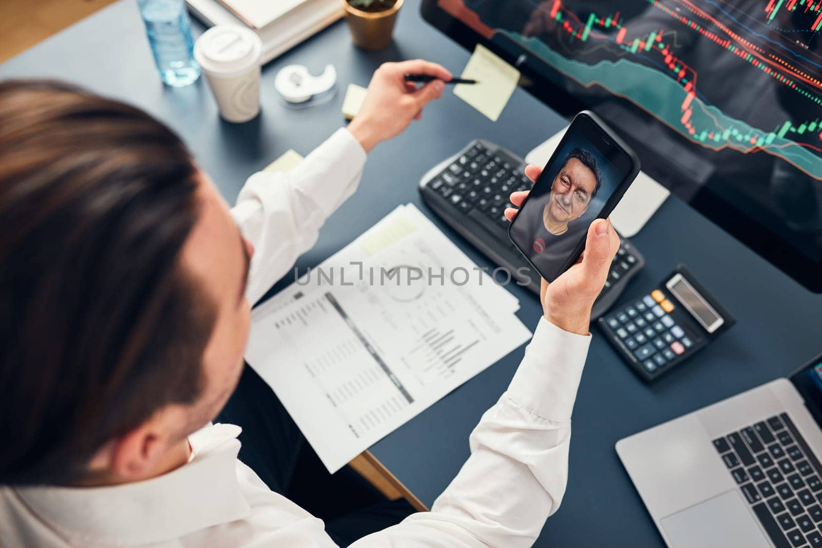 Businessman trading stocks online. Stock investor discussing numbers at graphs while video conversation with his colleague. Business team planning and analyzing stock market graphs. Man working with stock chart data. Business man investing stock using online platform. Business success concept