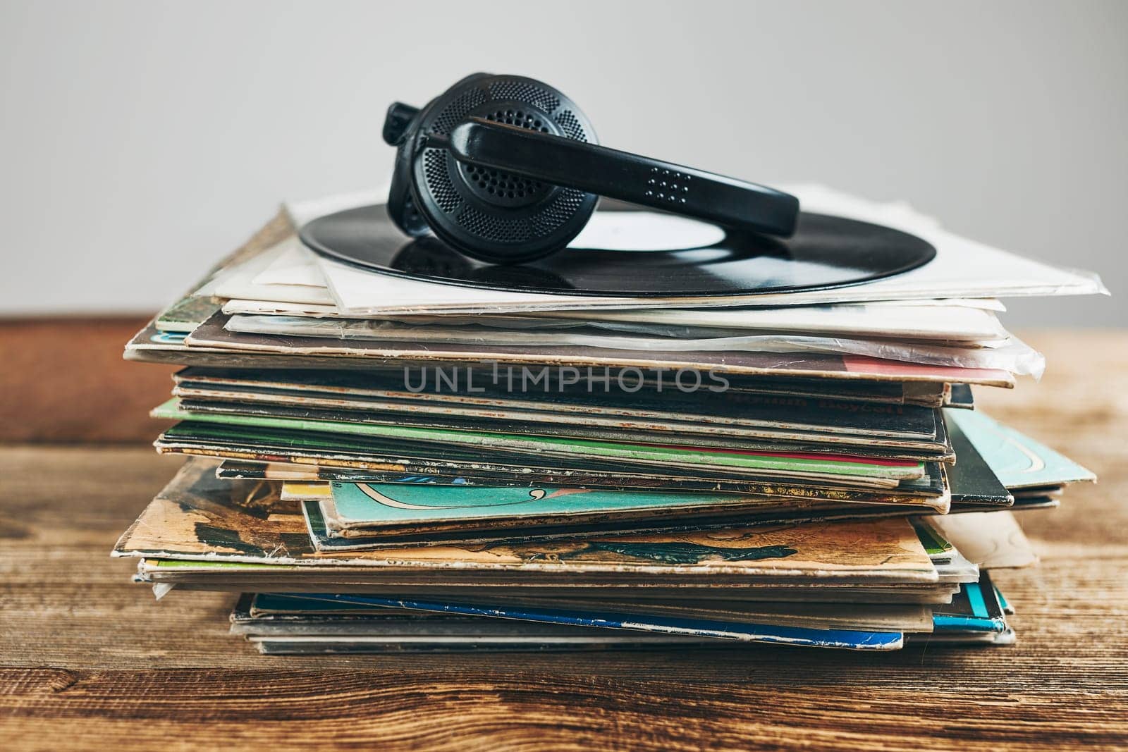 Stack of vinyl records. Listening to music from record. Playing music from analog disk. Retro and vintage. Audio stereo. Analog sound