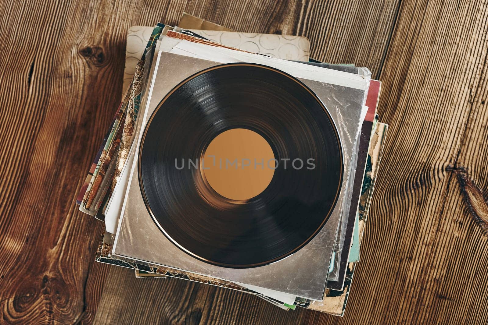 Stack of vinyl records. Listening to music from record. Playing music from analog disk. Retro and vintage. Audio stereo. Analog sound