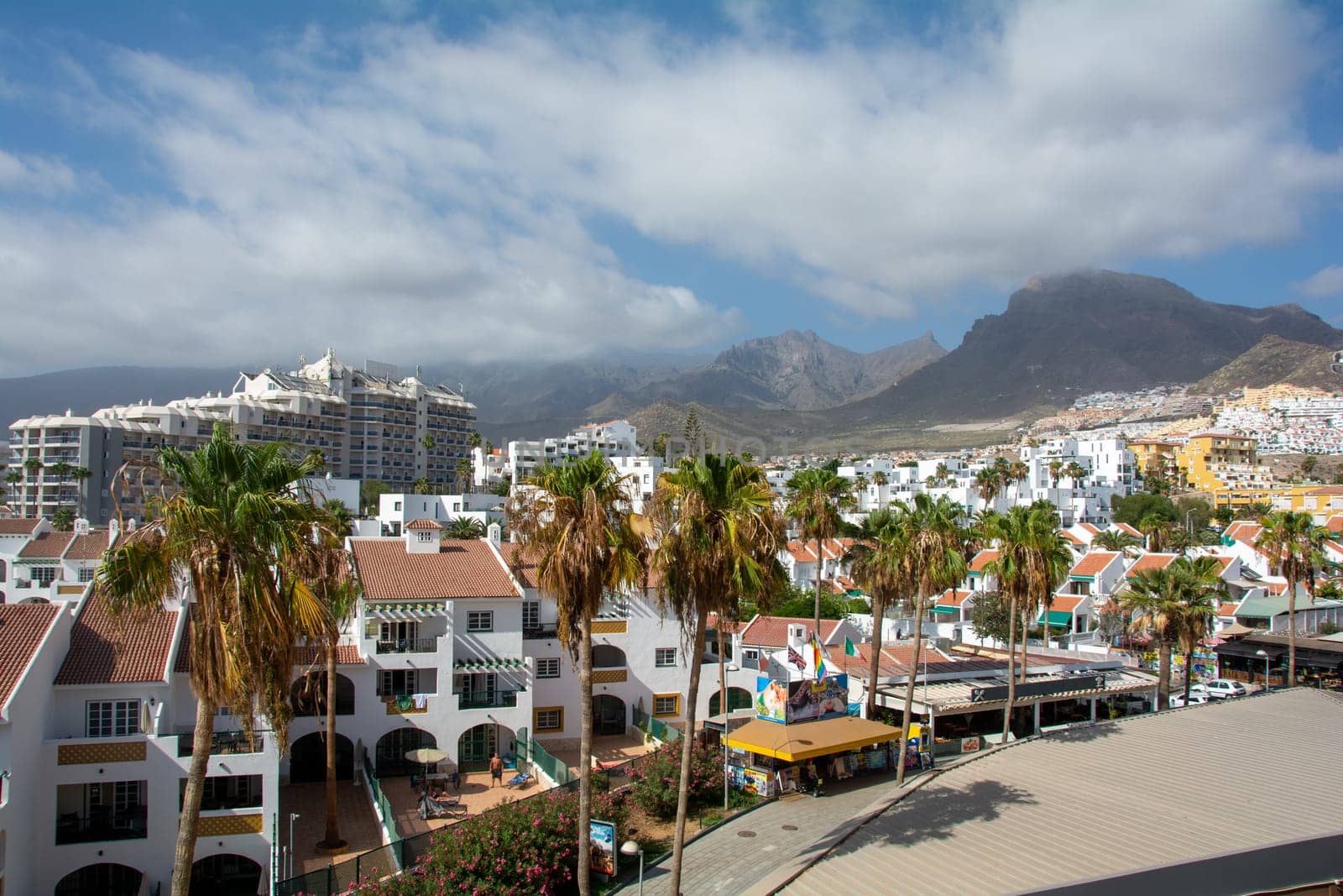 City of Costa Adeje in Spain on the Canary Island of Tenerife with mountains in the background