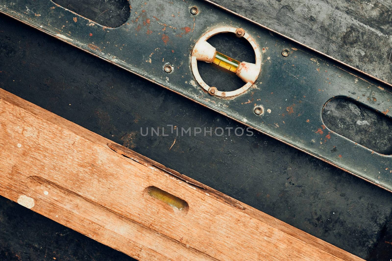 Level tool. Wooden and metal levels close up. Tools on metal surface. Measuring tool. Technical background with copy space