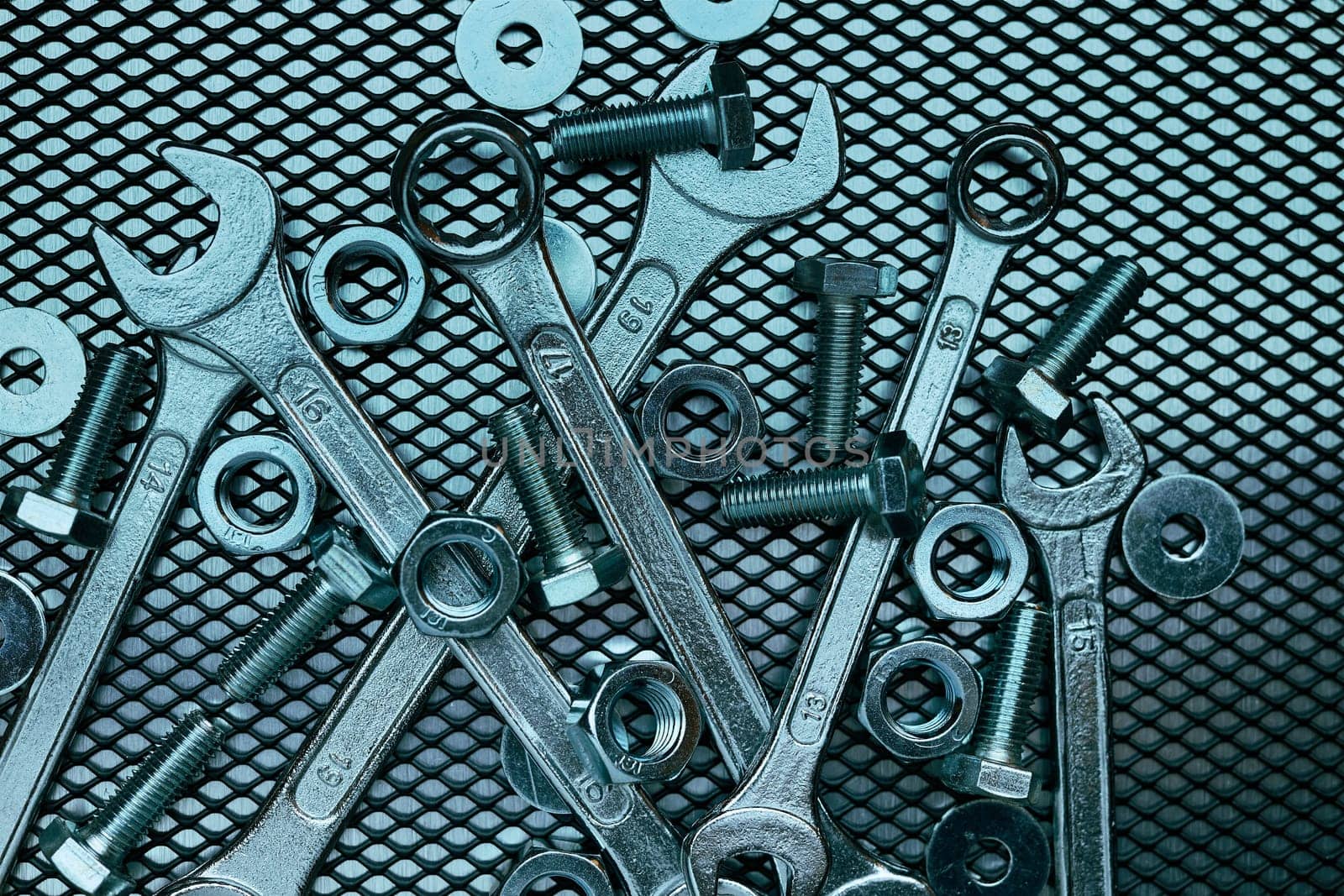 Set of chrome wrenches on steel surface. Mechanic tools for maintenance. Hardware tools to fix. Technical tools background