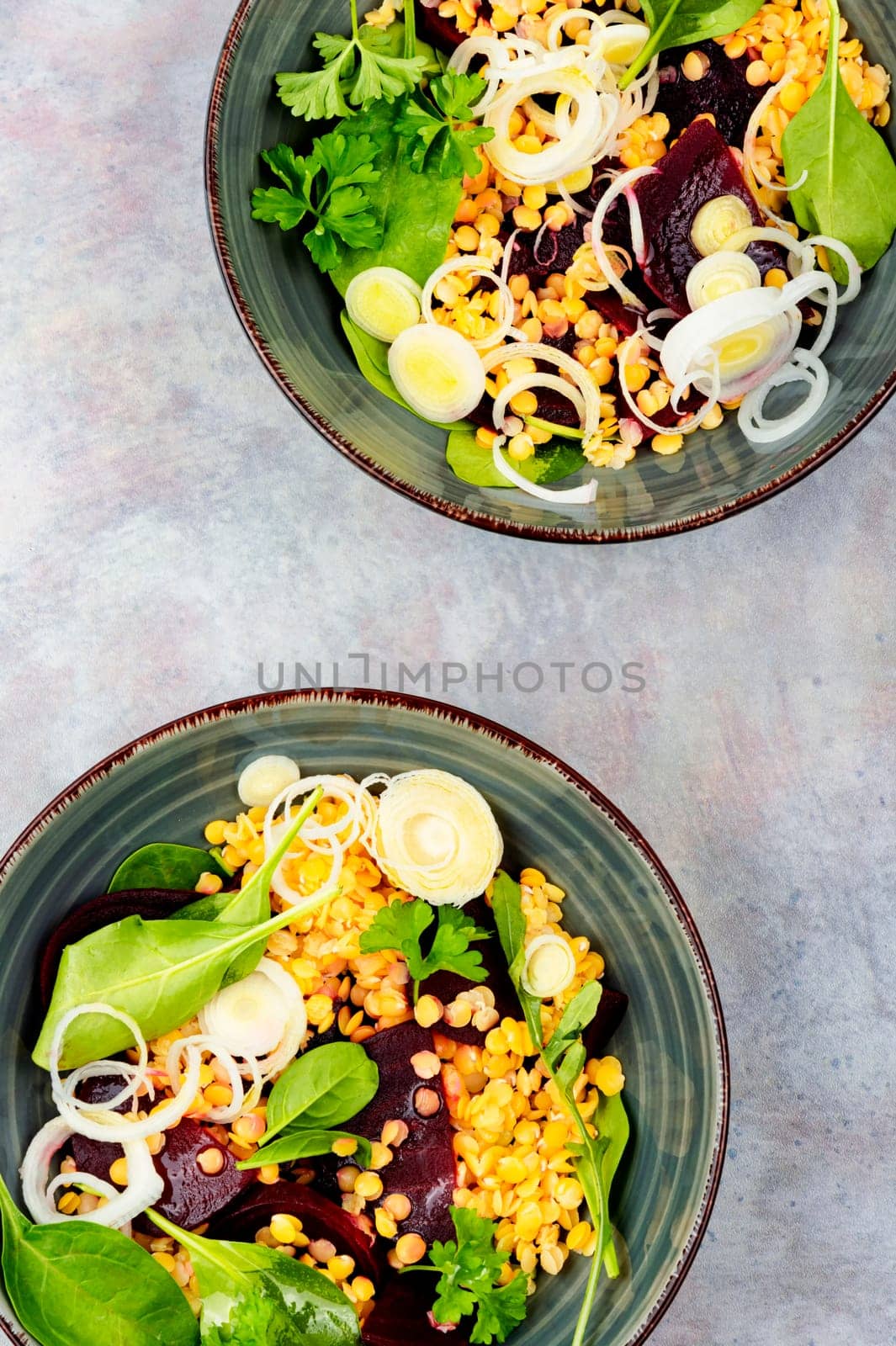 Vegetarian salad with beetroot, lentils, onions and herbs. Low calorie salad.