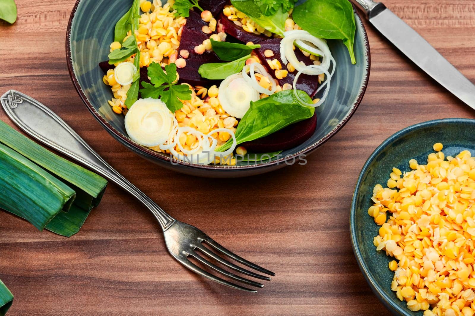 Vegetarian salad with beetroot, lentils, onions and herbs. Low calorie salad.