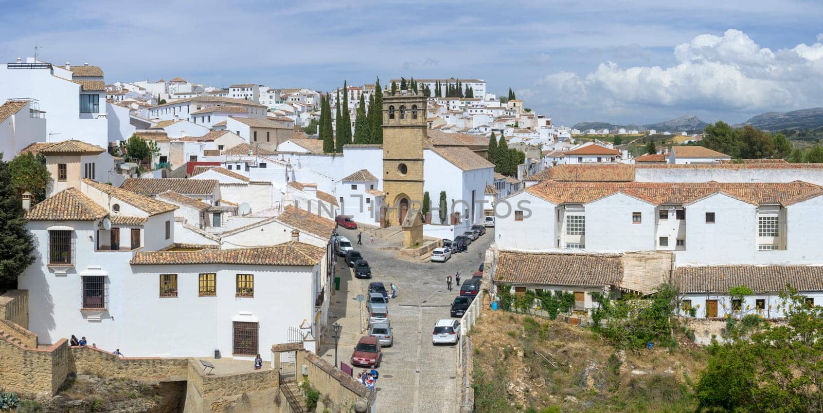 Ronda, Spain, April 2023: View on the whitewashed houses of Ronda in Andalusia and Padre Jesus church
