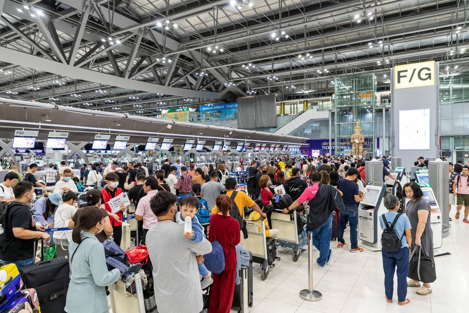 Bangkok, Thailand - April 10, 2023: Suvarnabhumi Airport with many travelers during the Songkran Festival because it is the Thai New Year which is a long holiday.There are many festivals in provinces.