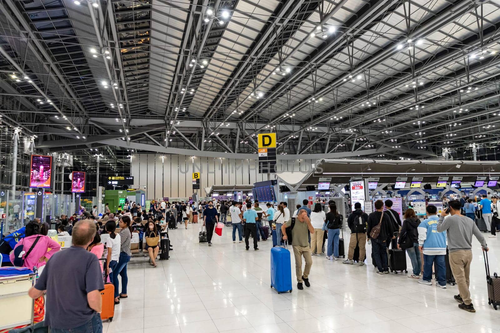 Bangkok, Thailand - April 10, 2023: Suvarnabhumi Airport with many travelers during the Songkran Festival because it is the Thai New Year which is a long holiday.There are many festivals in provinces.