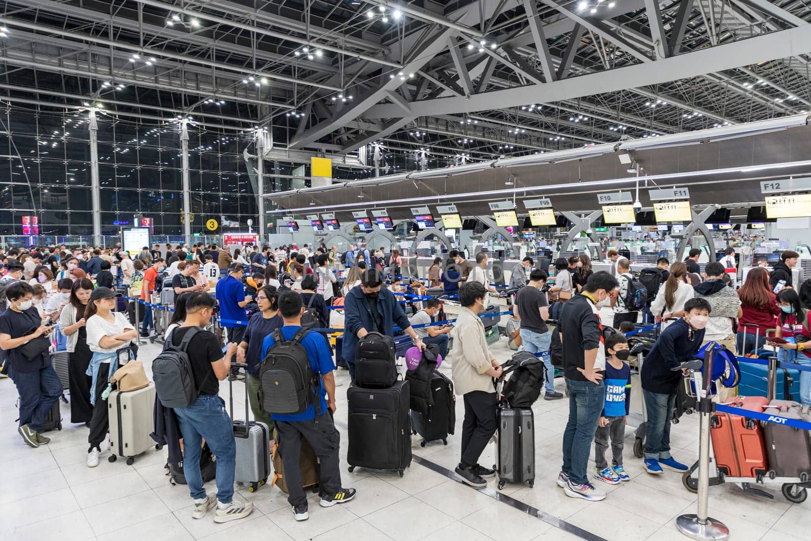 Bangkok, Thailand - April 10, 2023: Suvarnabhumi Airport with many travelers during the Songkran Festival because it is the Thai New Year which is a long holiday.There are many festivals in provinces.