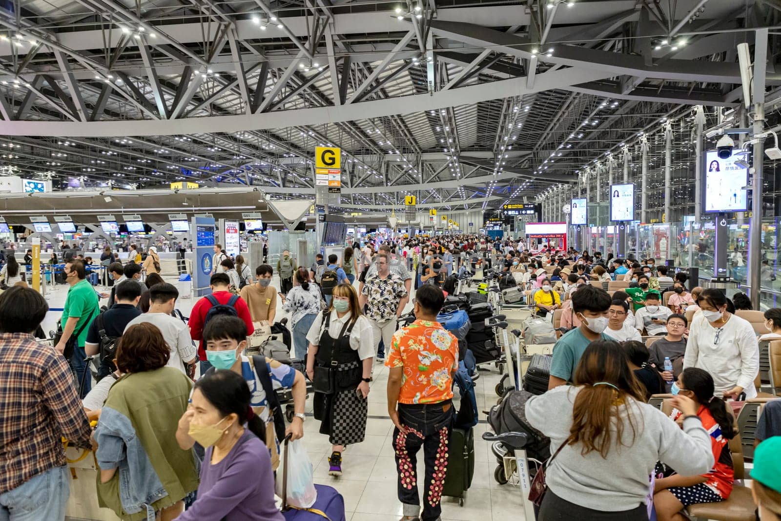 Bangkok, Thailand - April 10, 2023: Suvarnabhumi Airport with many travelers during the Songkran Festival because it is the Thai New Year which is a long holiday.There are many festivals in provinces.