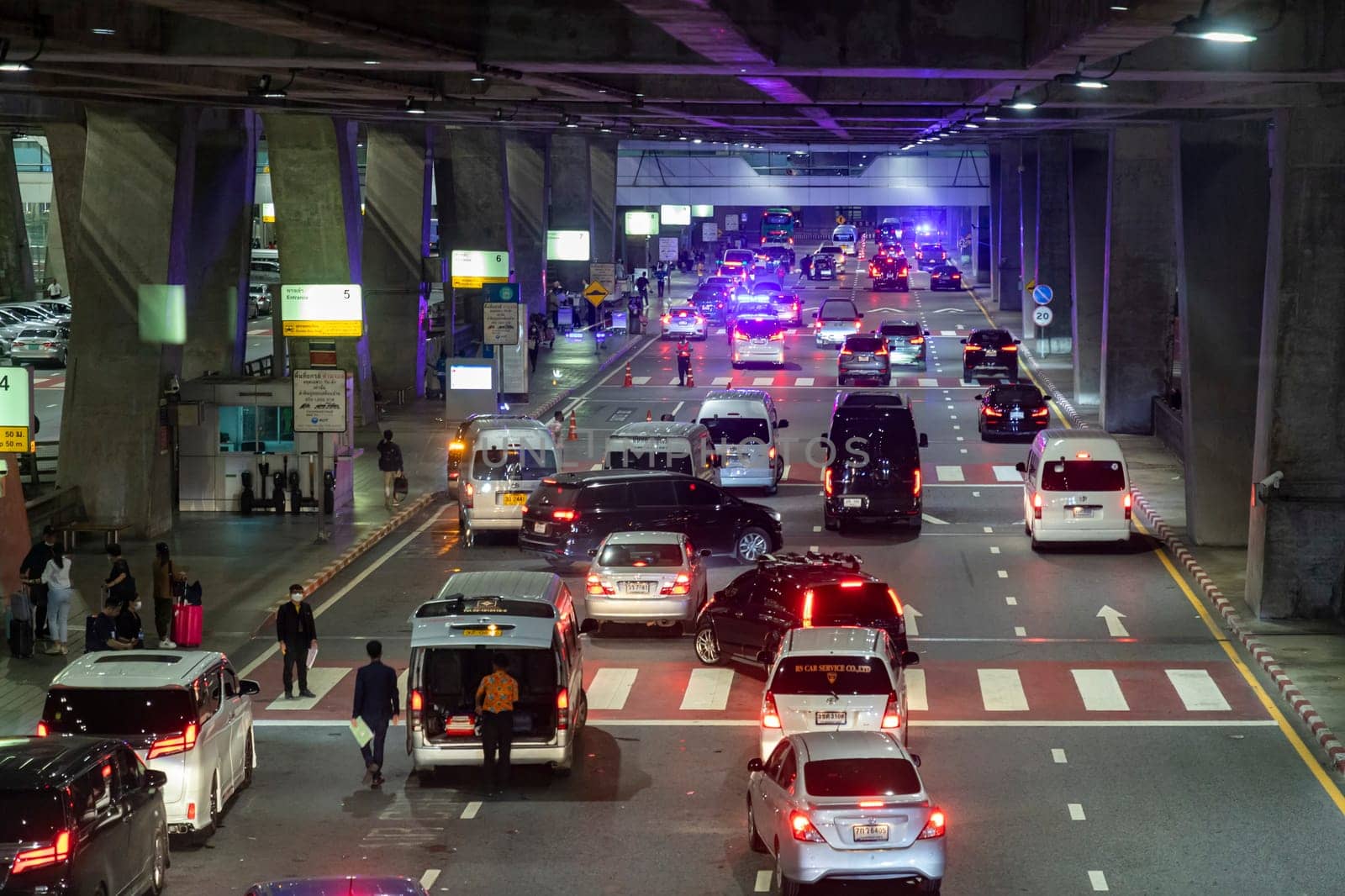 Bangkok, Thailand - April 10, 2023: Nighttime traffic jam on the road in front of Suvarnabhumi Airport during Songkran Festival, Thailand's New Year. Both Thai and foreign tourists travel a lot.