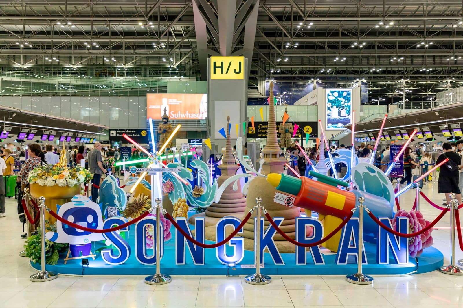 Bangkok, Thailand - April 10, 2023: Interior decoration that represents various aspects of Thai culture is displayed at Suvarnabhumi Airport during the Songkran festival, which is the Thai New Year.