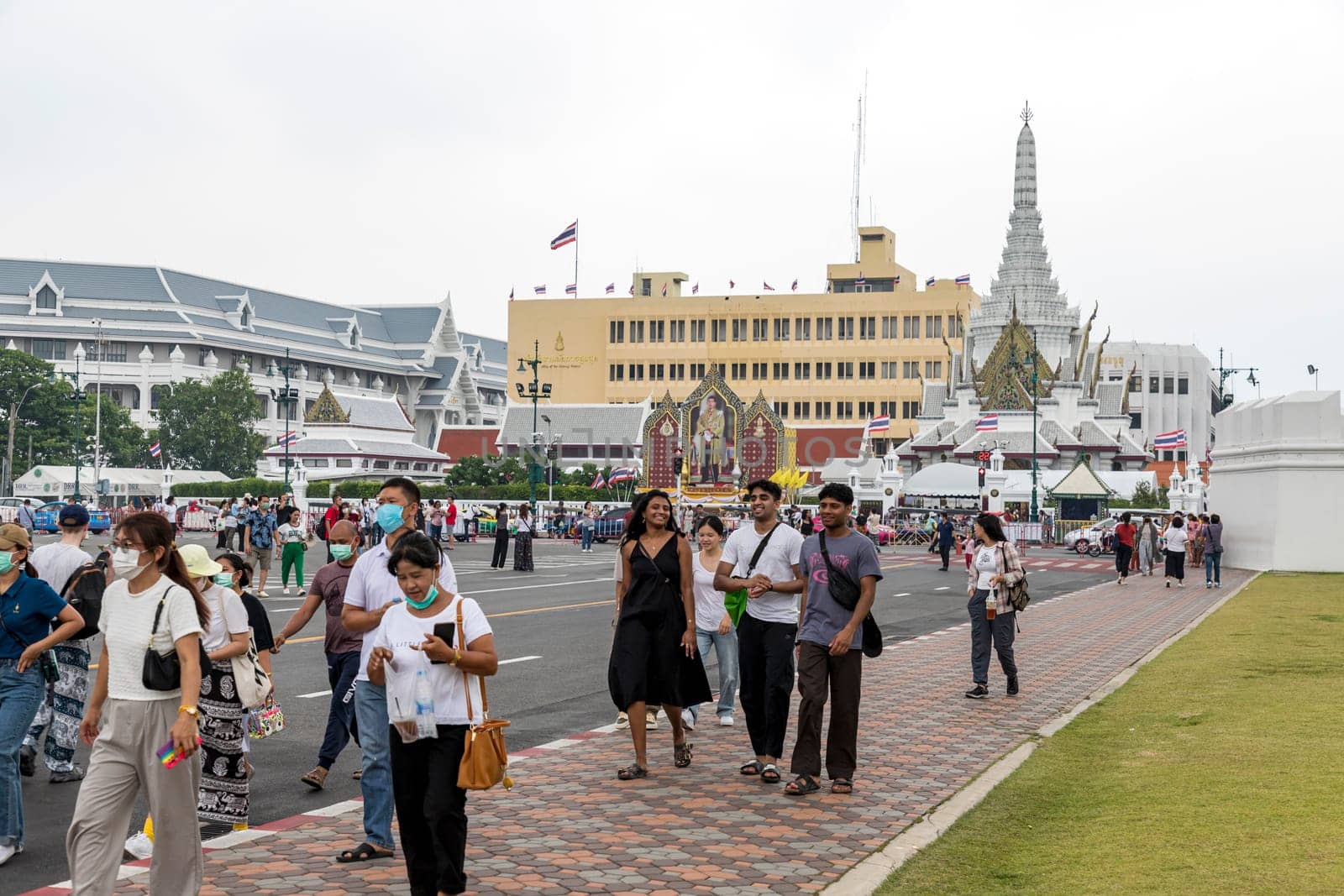 Bangkok,Thailand - April 16, 2023: Na Phra Lan Road is the road in front of Wat Phra Kaew. or the Grand Palace of Thailand Closed to traffic for a large number of tourists to walk around the place.