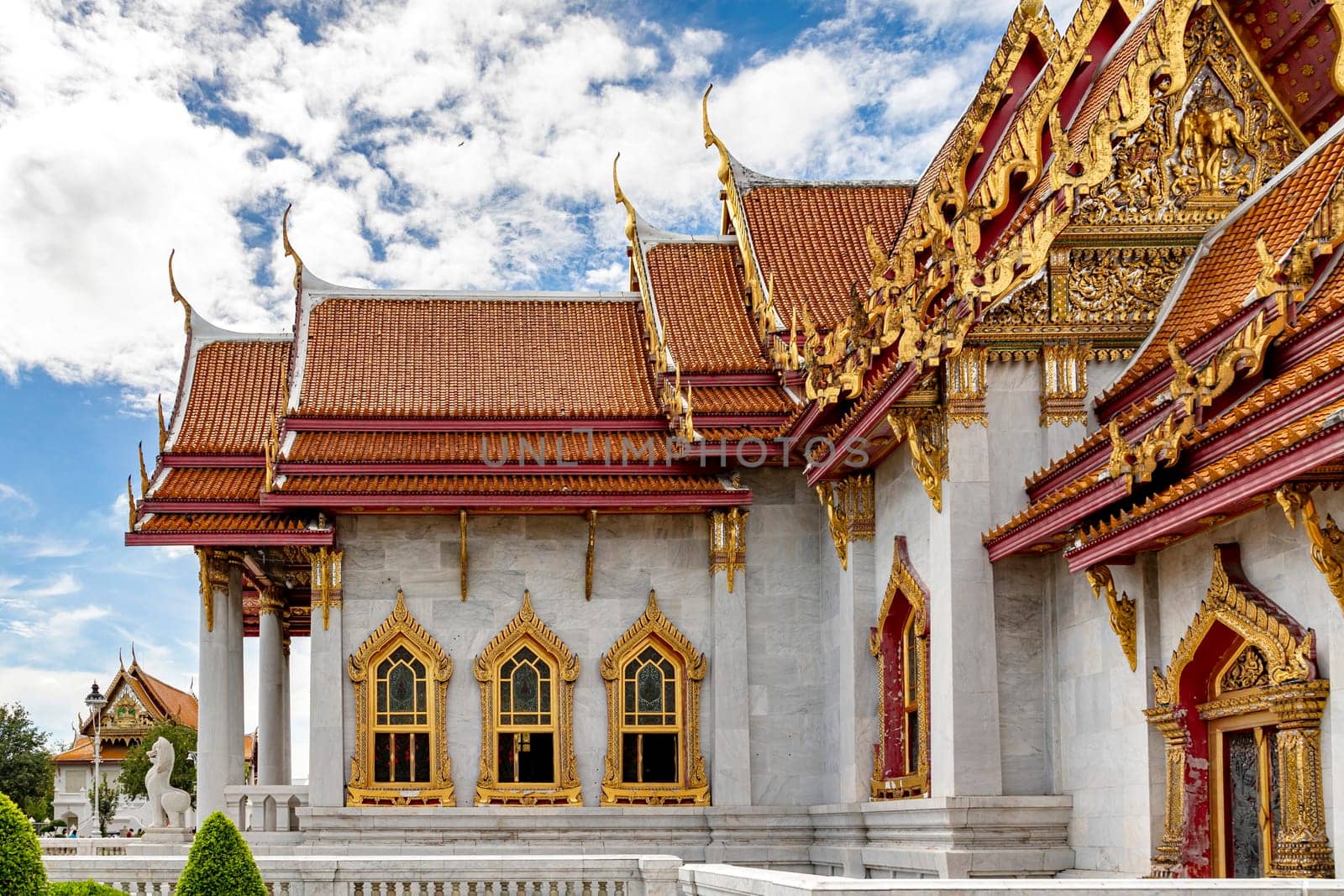 Wat Benchamabophit Dusit Wanaram (This temple is known as the Marble Temple) in Bangkok, blue sky and clouds. One of the most beautiful temples in Thailand Favorite destination in Bangkok. Daytime.