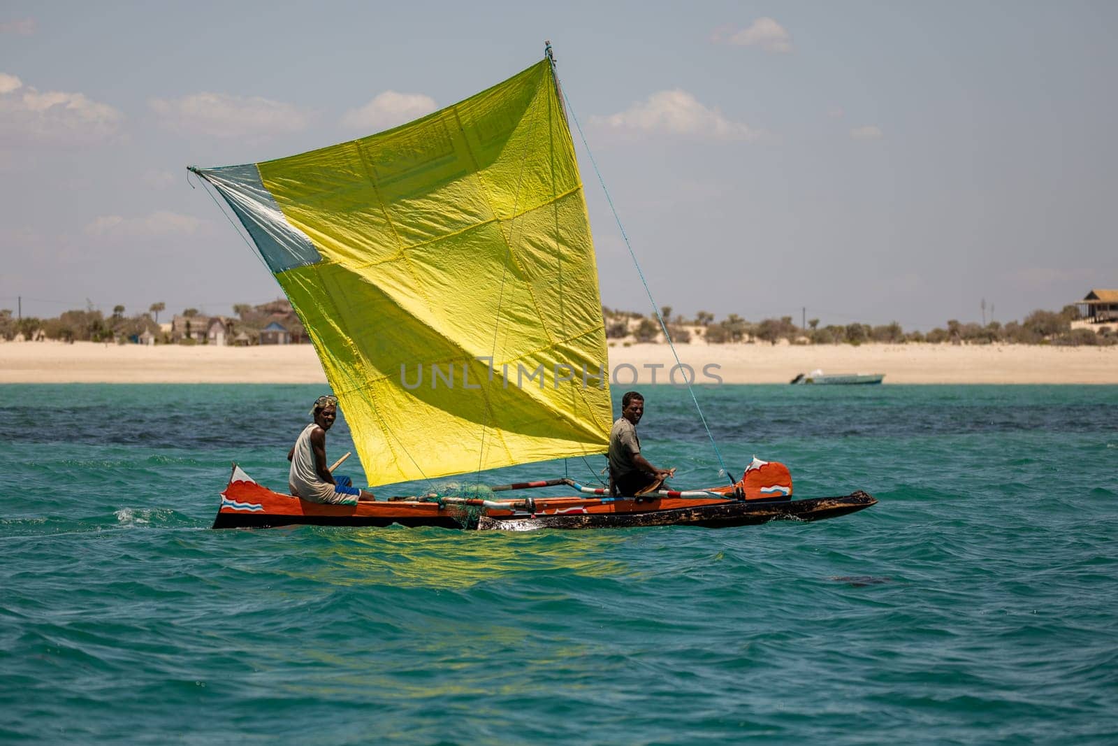 NOSY ISLAND, MADAGASCAR - NOVEMBER 22, 2022: Fishermen using sailboats to fish off the coast of Nosy Island in Madagascar. The primary source of livelihood in Anakao is fishing.